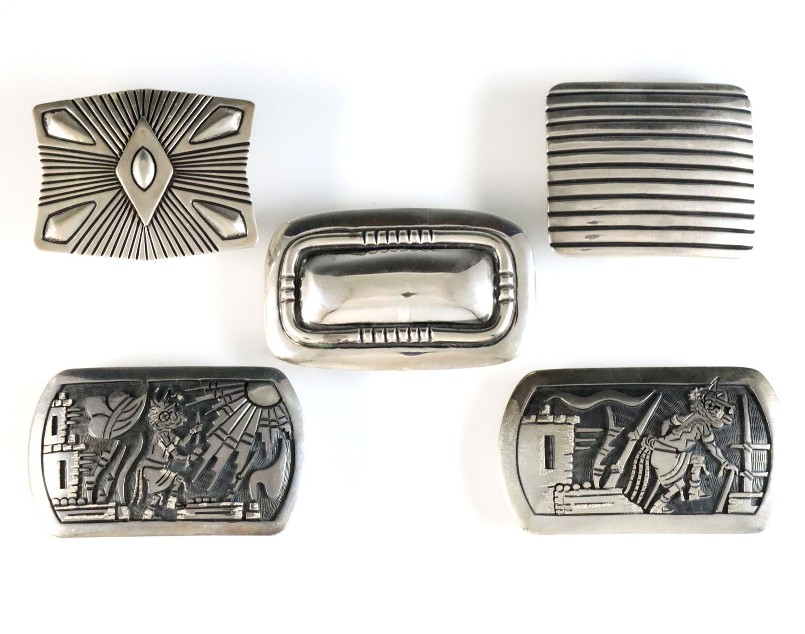 5 American Southwest Sterling Belt Buckles: Five American Southwest style Sterling Silver belt buckles. Includes two with Hopi Kachina designs by Edison Wadsworth, and three with geometric designs by Navajo artists Uncle Sam W. and Leonard Gene