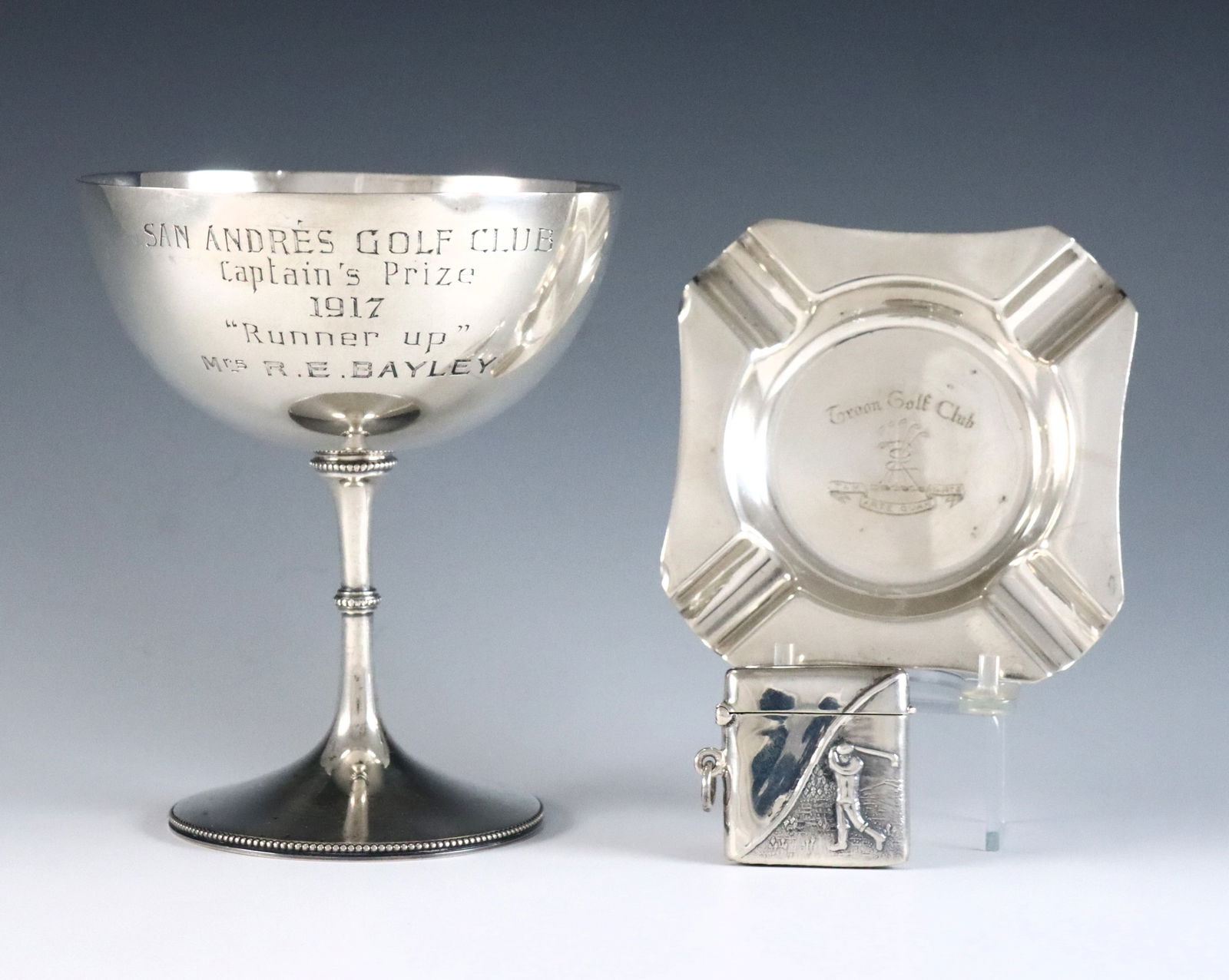 3 pc Sterling Golf Memorabilia: Three pieces of 20th century Sterling Silver golf memorabilia. Includes an English made trophy cup for "San Andreas Golf Club 1917" in Argentina, an English made ashtray for "Troon Golf Club" in Scotl
