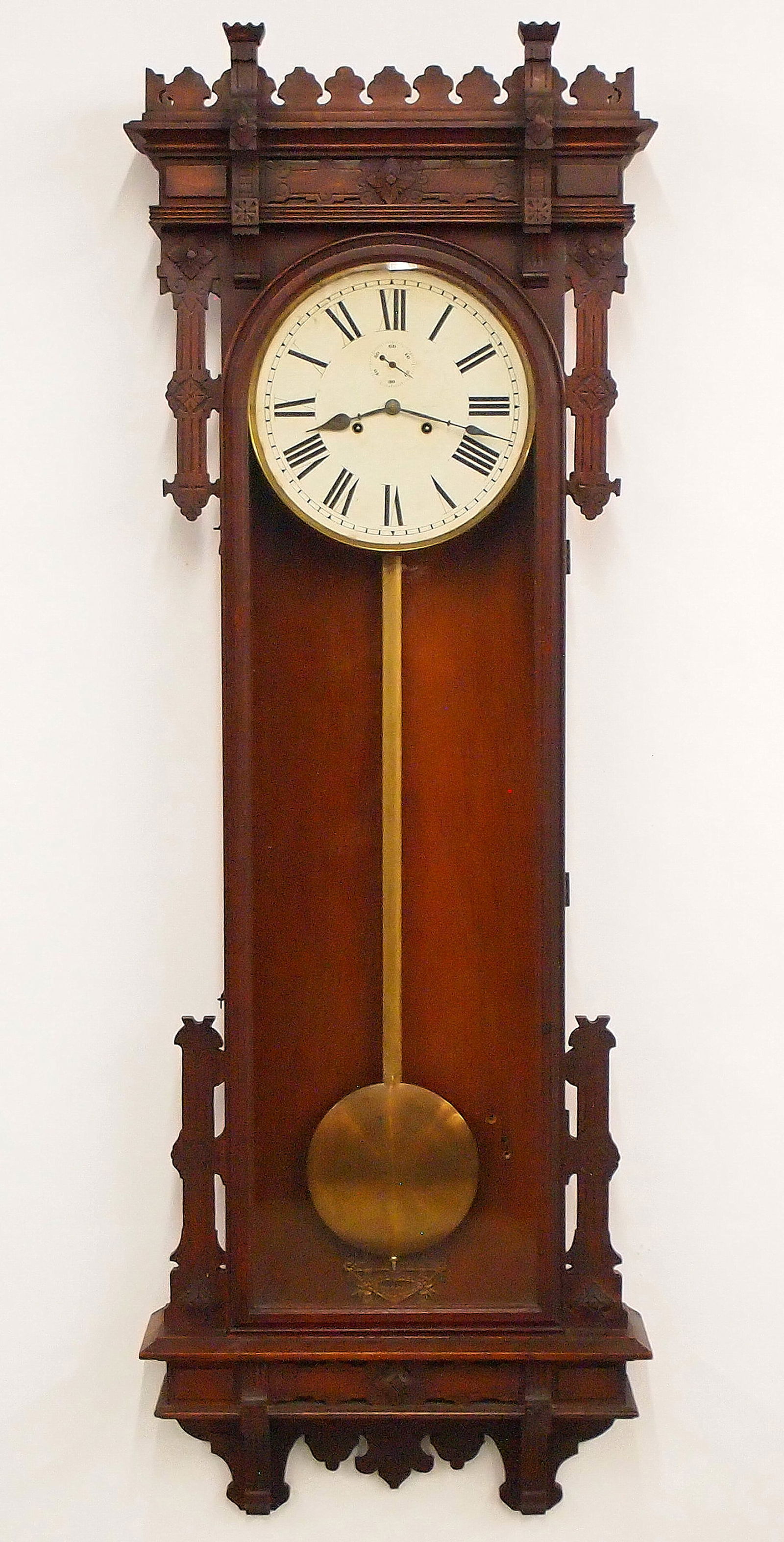 E. N. Welch No. 12 Regulator: A late 19th century E. N. Welch No. 12 Regulator wall clock. 30-day dual spring time only movement with papered metal dial with Roman numerals and subsidiary seconds in a molded Brass bezel, original