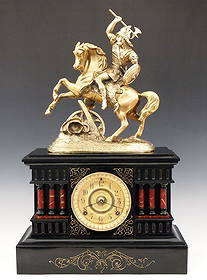 Ansonia Denmark Mantel Clock: A turn of the century Ansonia Denmark model enameled Iron mantel clock. 8-day time and strike movement with gilded dial and Arabic numerals. Black enameled Iron case with molded top and Brass patinate