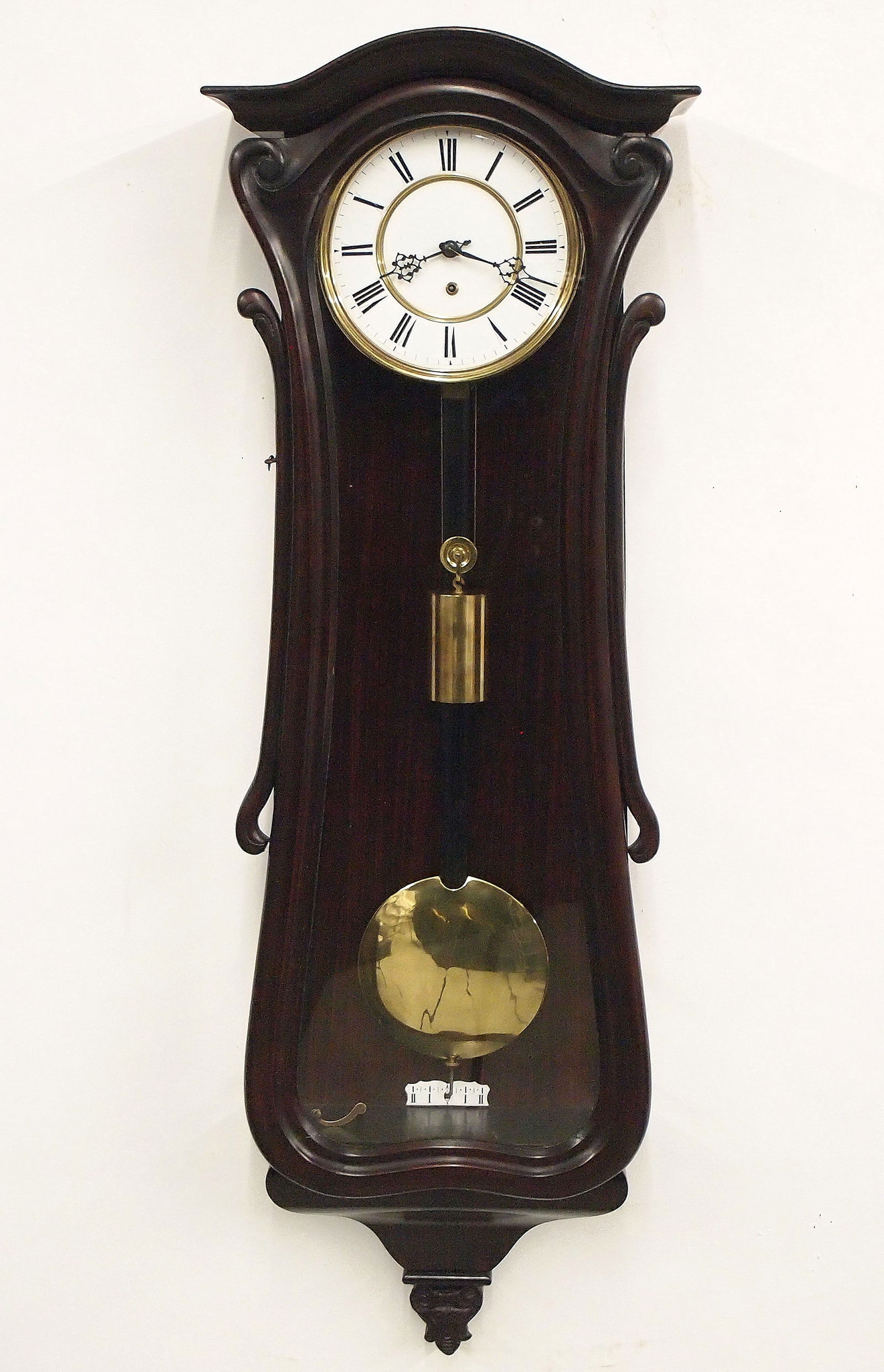 1 Weight Vienna Regulator Wall Clock: A 19th century one weight Vienna Regulator wall clock. 8-day time only movement with two part porcelain dial and Roman numerals with a brass bezel. Grain painted Serpentine case with an arched crown o