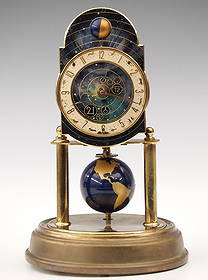 Kaiser Universe 400 Day Clock: A mid 20th century Kaiser Universe model 400 day clock. Brass painted dial with upper moon phase, Silvered chapter ring with Arabic numerals and Zodiac signs with moon phase and a rotating globe pendu