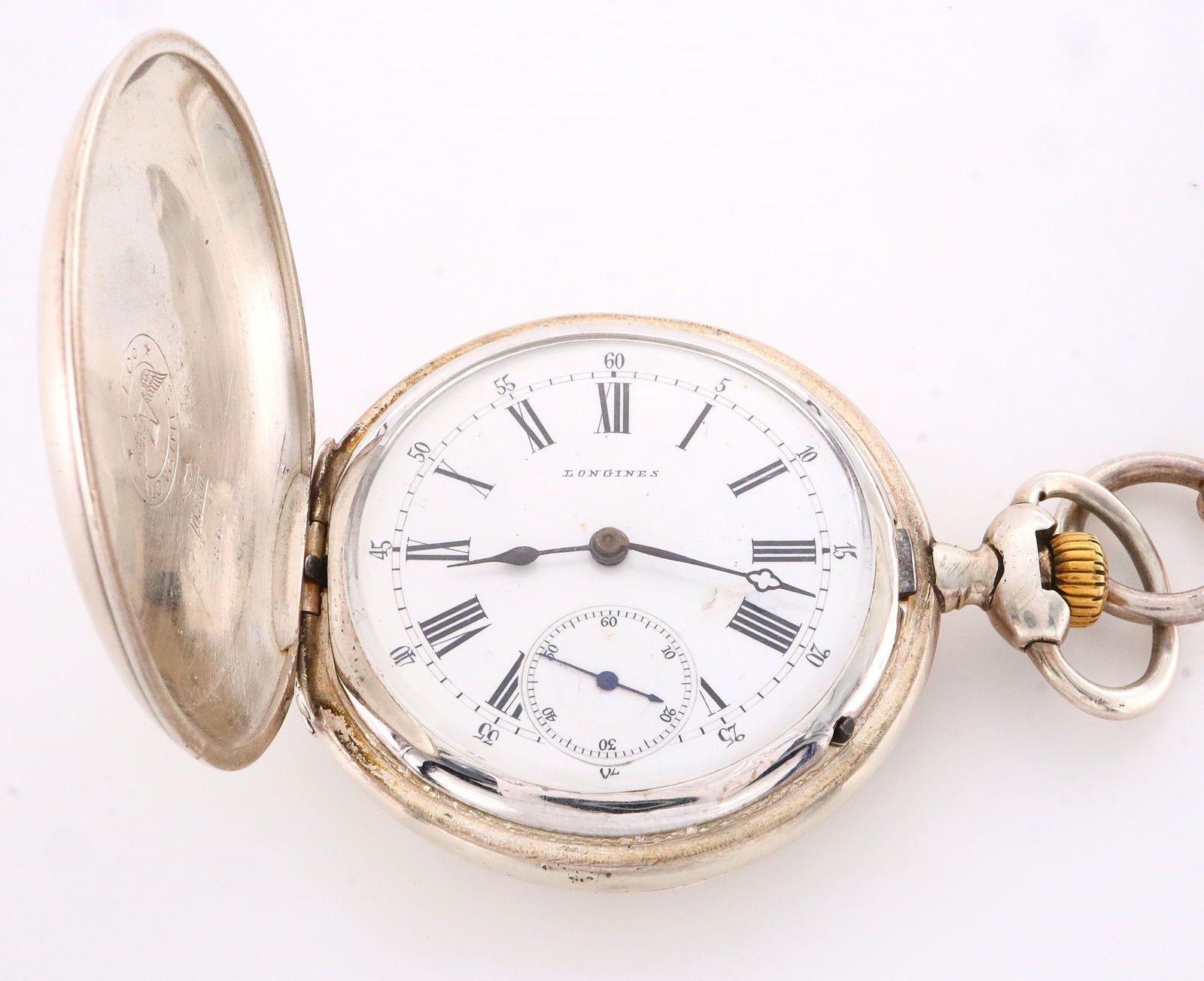 Longines Pocket Watch: A Longines Silver pocket watch with chain. 54mm, 15 j, SW, LS, Longines .800 Silver, Engraved HC, porcelain SSD with Roman numerals marked "Longines". Some case wear, monogramed, winds, sets and runni