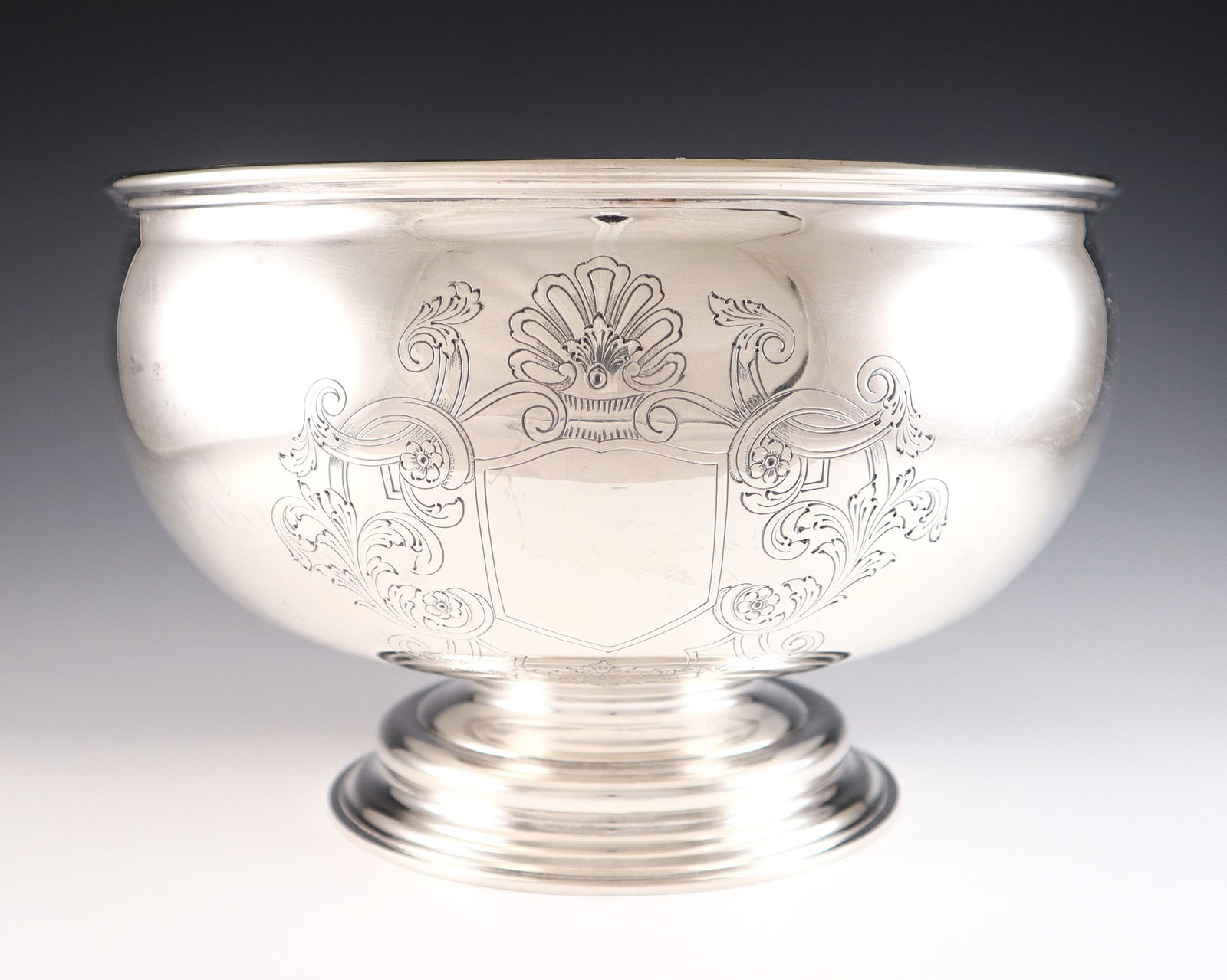 Buccellati Sterling Center Bowl: A late 20th century Buccellati Sterling Silver center bowl. Footed form with engraved decoration depicting a heraldic crest. Impressed "Buccellati / Italy" and "Sterling" with Milan hallmark. 46.11 tr
