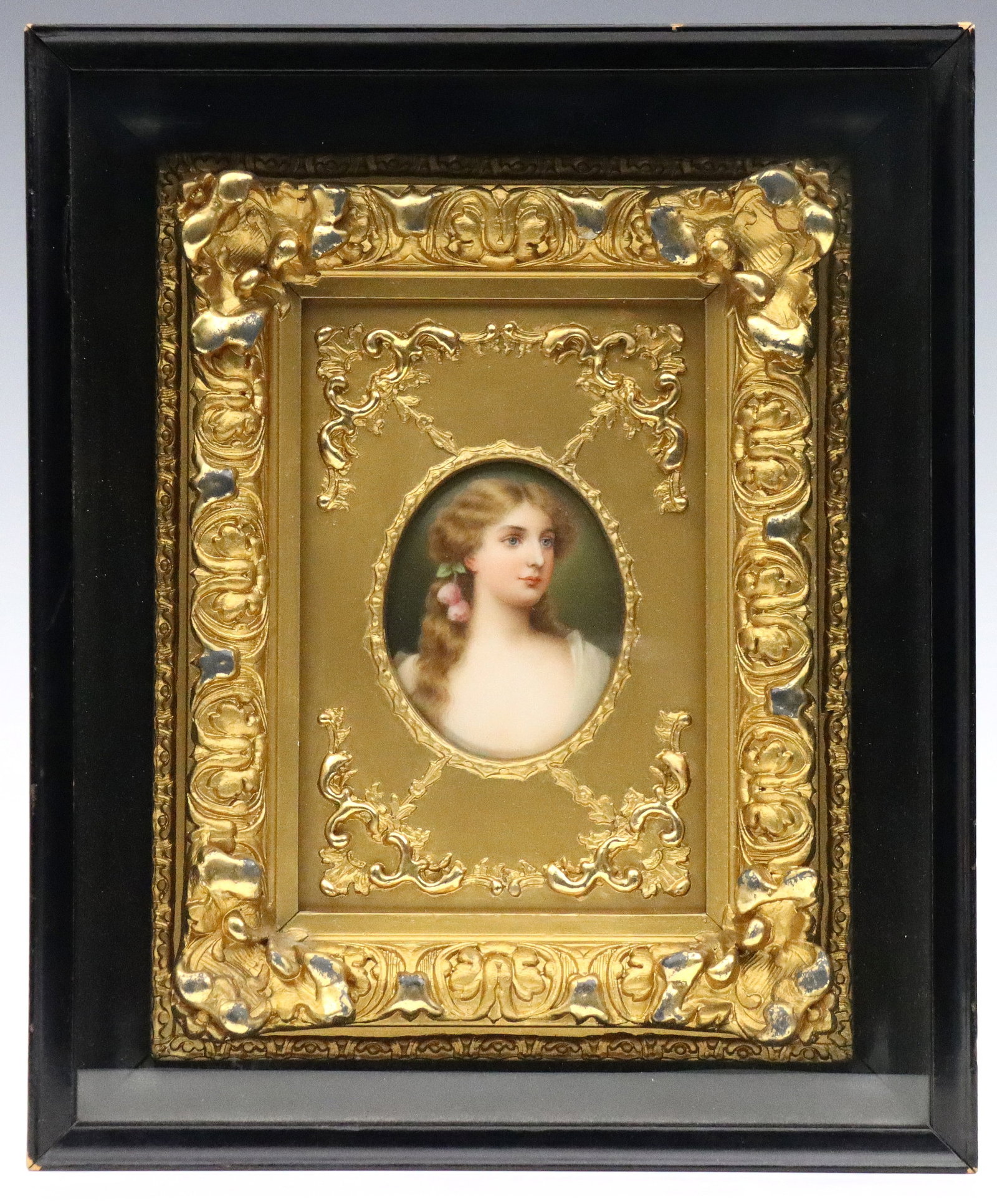 Hutschenreuther Porcelain Portrait Plaque: A turn of the century Hutschenreuther porcelain portrait plaque. Hand-painted quarter length portrait of a young maiden with roses in her hair, titled "Tea Rose". Impressed "CM HR" in Shield and Crown