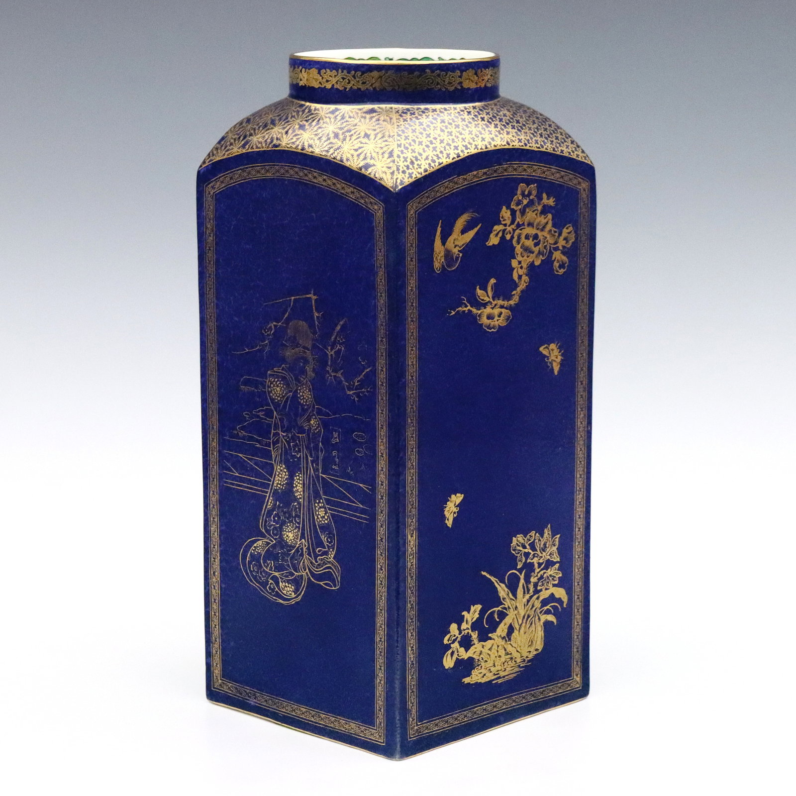 Wedgwood Art Pottery Vase: A turn of the century Wedgwood Art Pottery vase. Rectangular form with rounded shoulder and Gilded Chinoiserie decoration depicting alternating figures and florals on a mottled Cobalt Blue ground. Pri