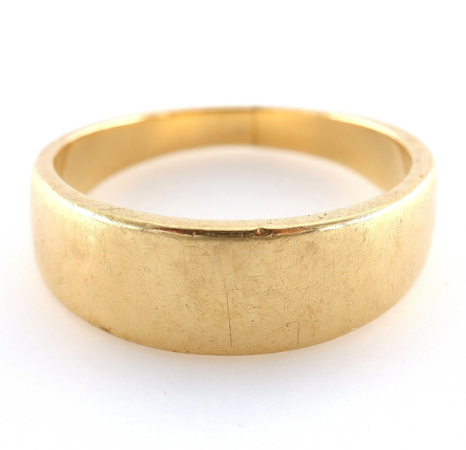 14k Gold Wedding Band: A 14k Yellow Gold tapered wedding band. Marked "14k". 5.2 grams total weight. Some surface wear. Size 7 3/4. ESTIMATE $300-500