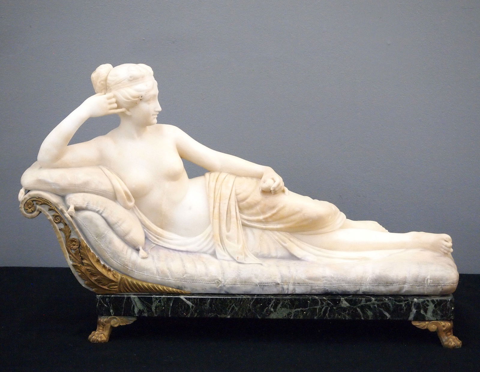 Alabaster Figure After Canova: An early 20th century carved Alabaster figure of Paolina Borghese Bonaparte, depicted as Venus Victrix, after Antonio Canova (Italian, 1757-1822). Depicts the semi nude Princess posed reclining on an