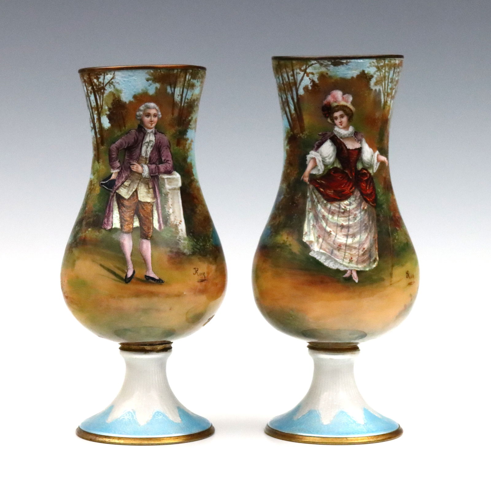 Pr French Enameled Copper Vases: A pair of 19th century French enameled Copper portrait vases. Baluster form with hand-enameled scenic decoration depicting a gentleman and lady standing before forested landscape with a lake. 