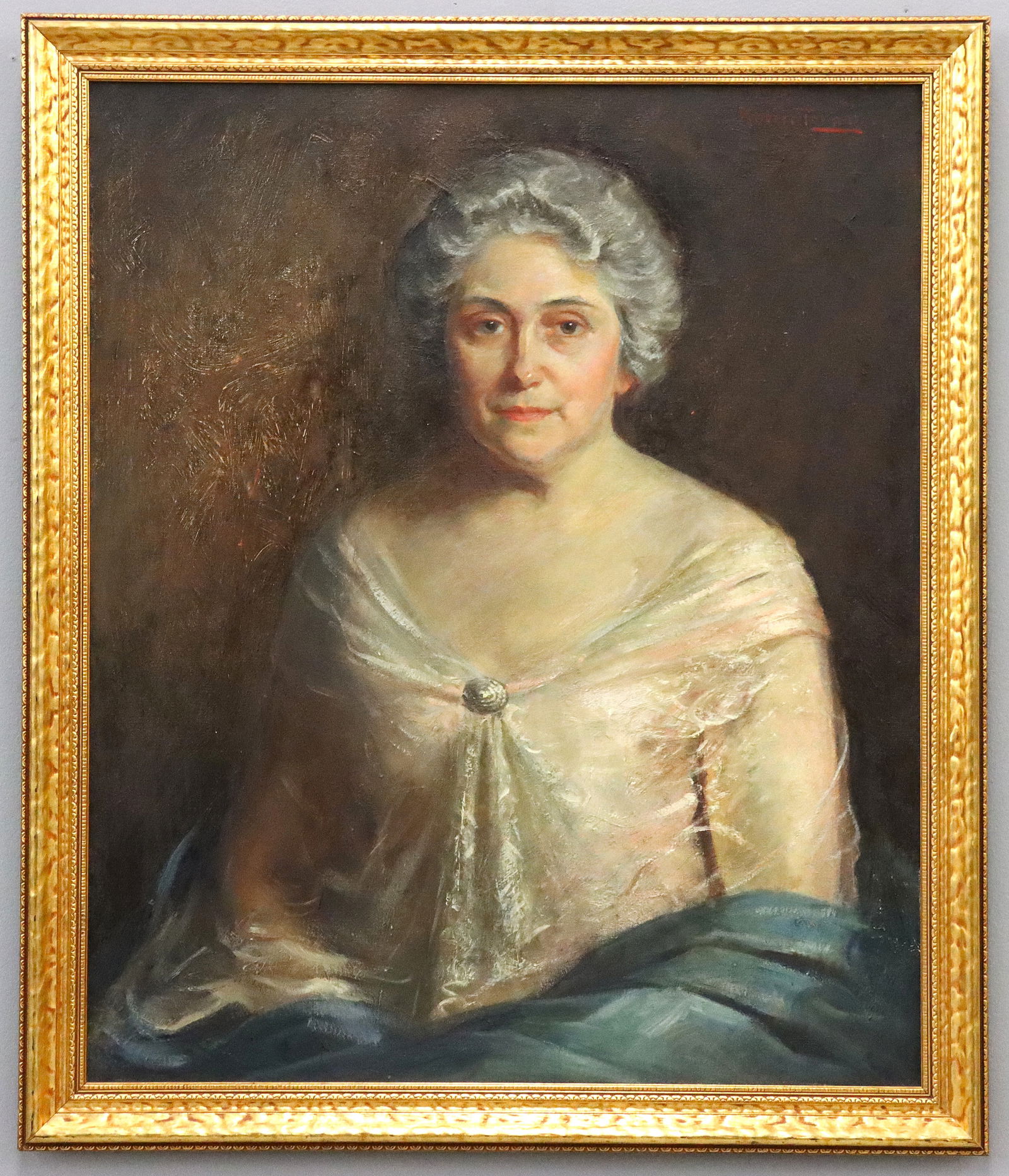 Robert Tolman Portrait of a Woman: Robert Tolman, American, 1886-1967. An early 20th century oil on canvas portrait of a woman. Depicted half length, seated with her Grey hair pulled back from her face wearing a gossamer gown accentuat