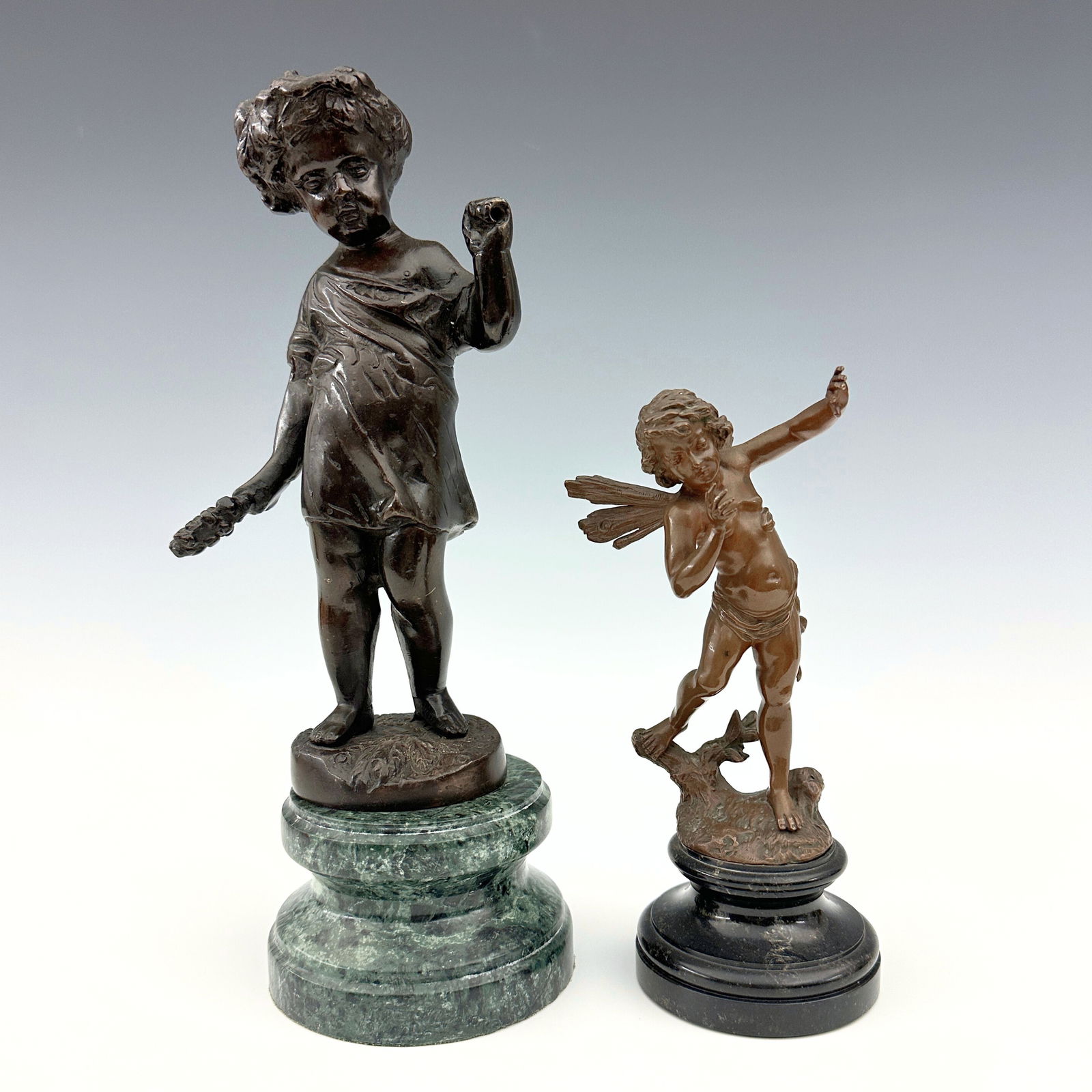2 Bronze Figures: Two early to mid 20th century Bronze figures. Includes an Allegorical depiction of an Autumn Putto presented on a shaped Verde Marble plinth after Clodion (Claude Michel), and a figure of a Nymph
