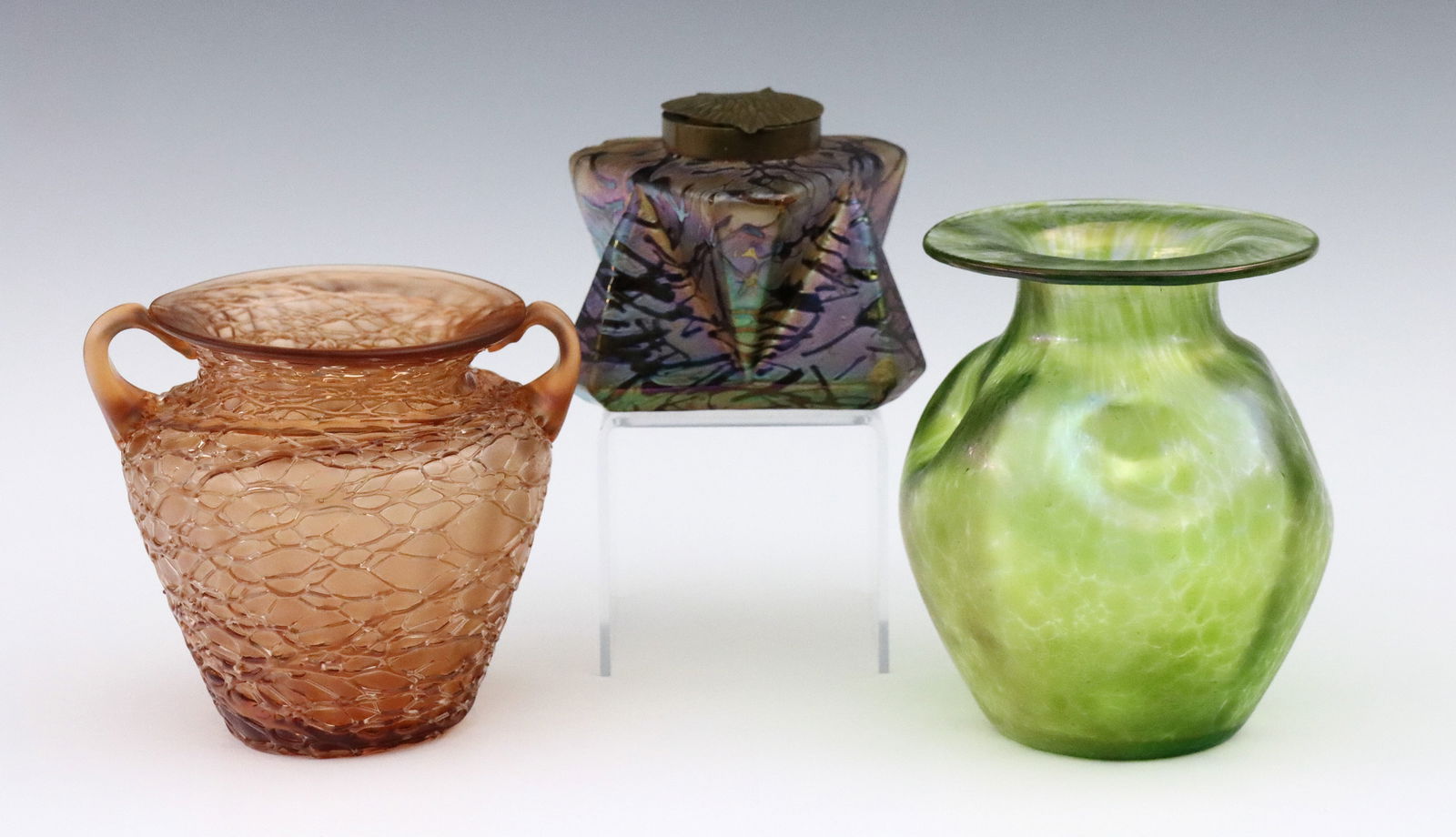 3 pc Bohemian Art Glass: Three pieces of turn of the century Bohemian Art Glass attributed to Loetz and Kralik. Includes an inkwell with mottled Iridescent Purple and Gold finish, a Green "Creta" bulbous form vase with
