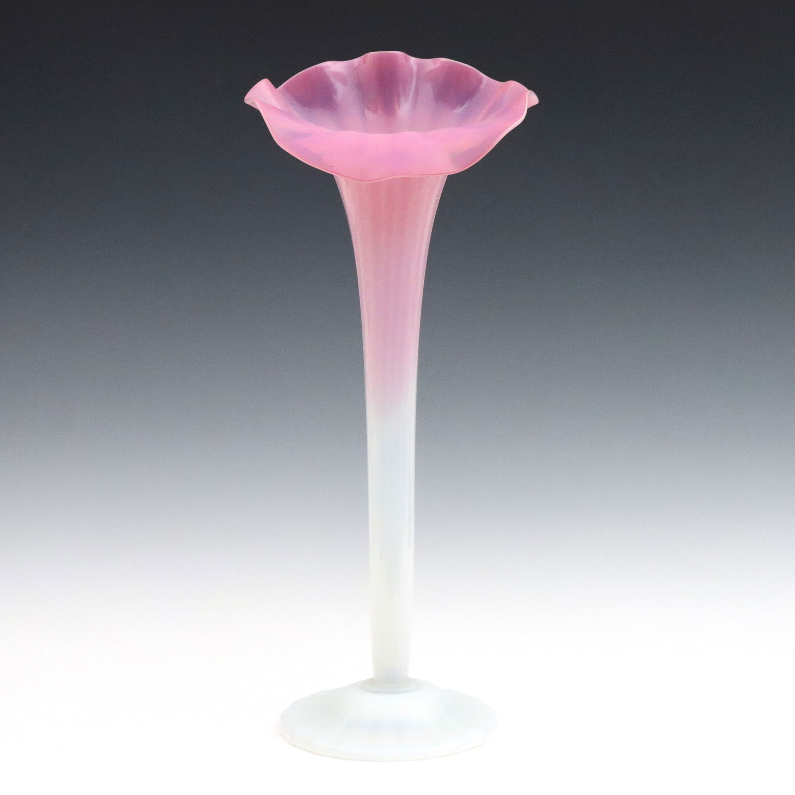 Victorian Jack-in-the-Pulpit Glass Vase: A 19th century late Victorian Period Jack-in-the-Pulpit Art Glass vase. Cranberry and Opalescent glass vase with tall floral form and fluted body. Unmarked. Minor surface wear. 18" high. ESTIMATE $200