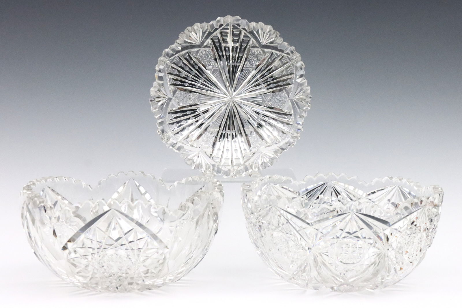 3 Libbey Cut Glass Bowls: Three early 20th century Libbey Brilliant cut glass bowls. Includes an "Anita" pattern bowl, a "Gem" pattern bowl, and a nappy with hobstar and fan design. Each marked "Libbey" at interior. Several ch