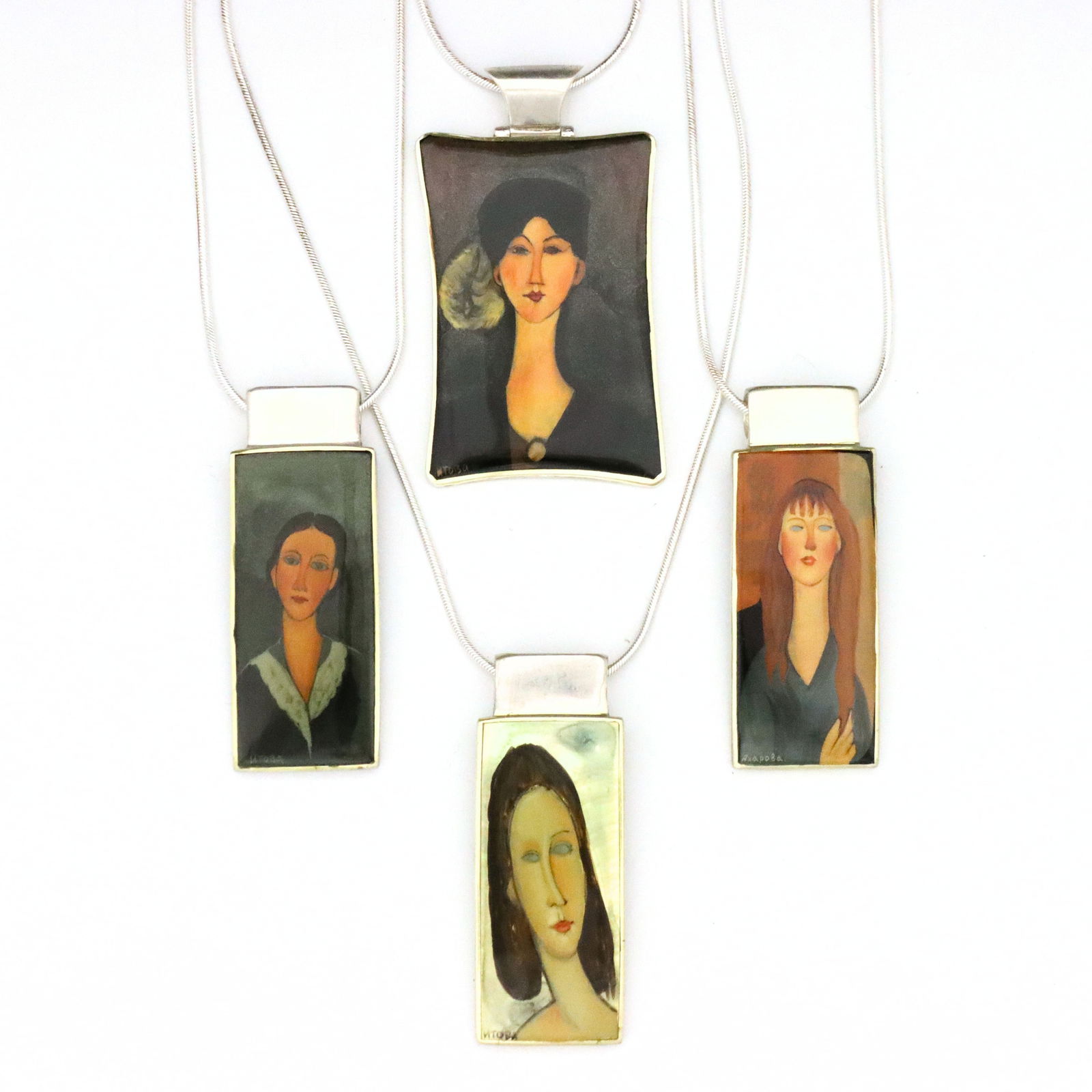 4 Modigliani Sterling Silver Lacquer Necklaces: Four vintage Russian Sterling Silver lacquer necklaces after Amedeo Modigliani. Rectangular form pendants with enameled lacquer miniatures after works by Modigliani set in Sterling Silver frames. 