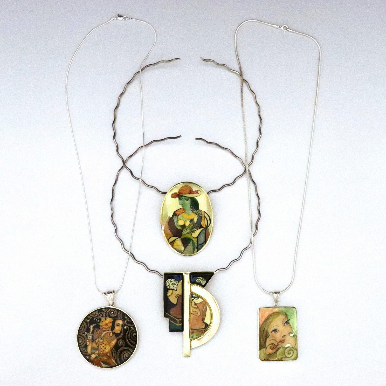 4 Picasso & Klimt Sterling Silver Lacquer Necklaces: Four vintage Russian Sterling Silver lacquer necklaces after Pablo Picasso and Gustav Klimt. Various form pendants with enameled lacquer miniatures after works by Picasso and Klimt set in Sterling Sil