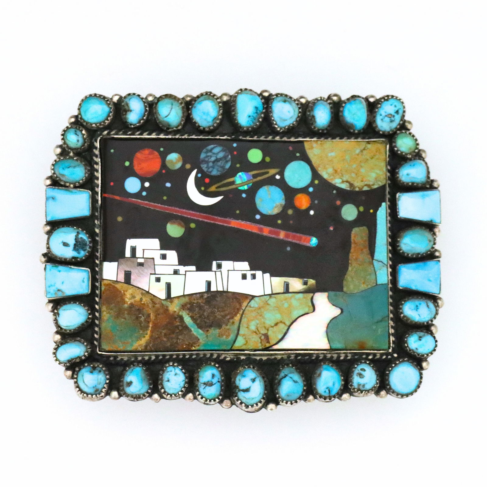 David Freeman Jr. Sterling Galaxy Belt Buckle: A vintage Native American style Sterling Silver belt buckle by David R. Freeland Jr. From his "Galaxy" series, features a rectangular buckle with inlaid Turquoise, Mother of Pearl, Jet, Oyster shell,