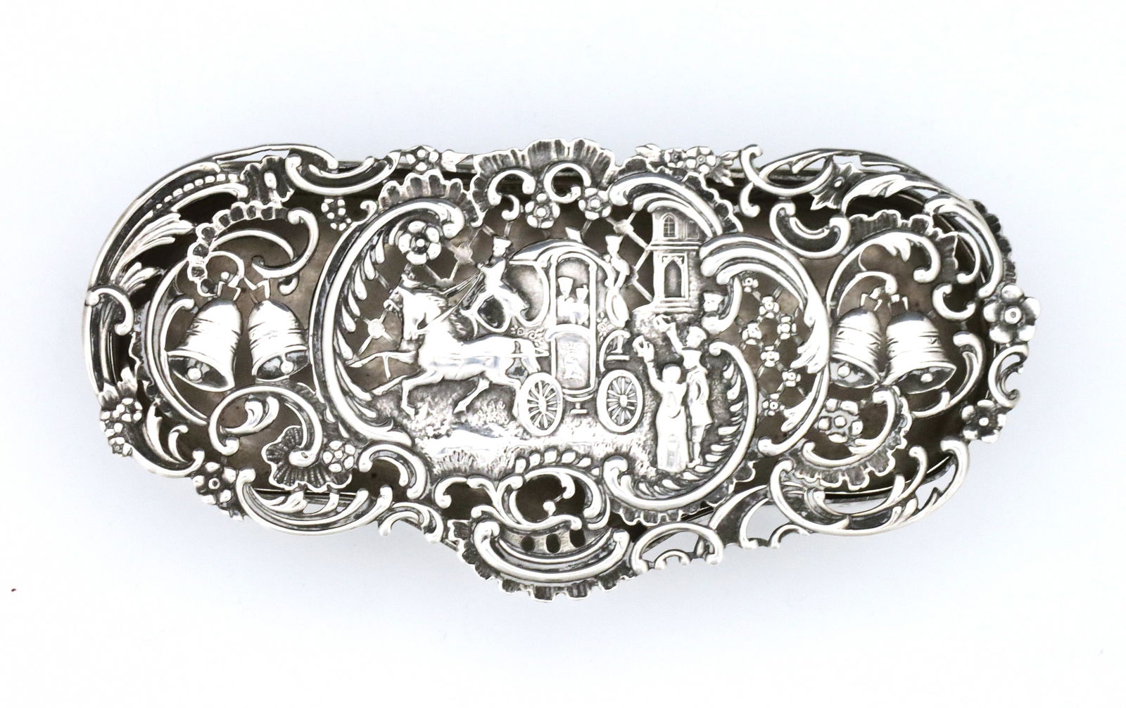 English Sterling Potpourri Box: A turn of the century English Sterling Silver potpourri box by William Comyns. Scalloped form with a hinged lid, featuring pierced scenic decoration depicting villagers toasting a passing carriage,