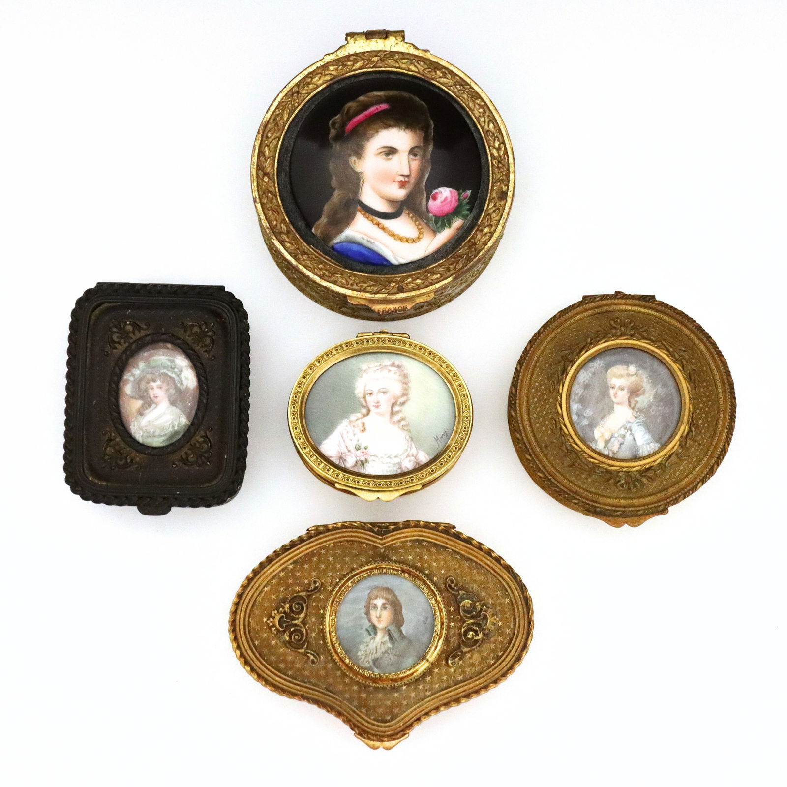 5 French Brass Portrait Boxes: Five turn of the century French Brass portrait boxes. Brass boxes with engraved decoration and hinged lids featuring hand-painted and enameled portraits. Three marked "France", the four portraits unde