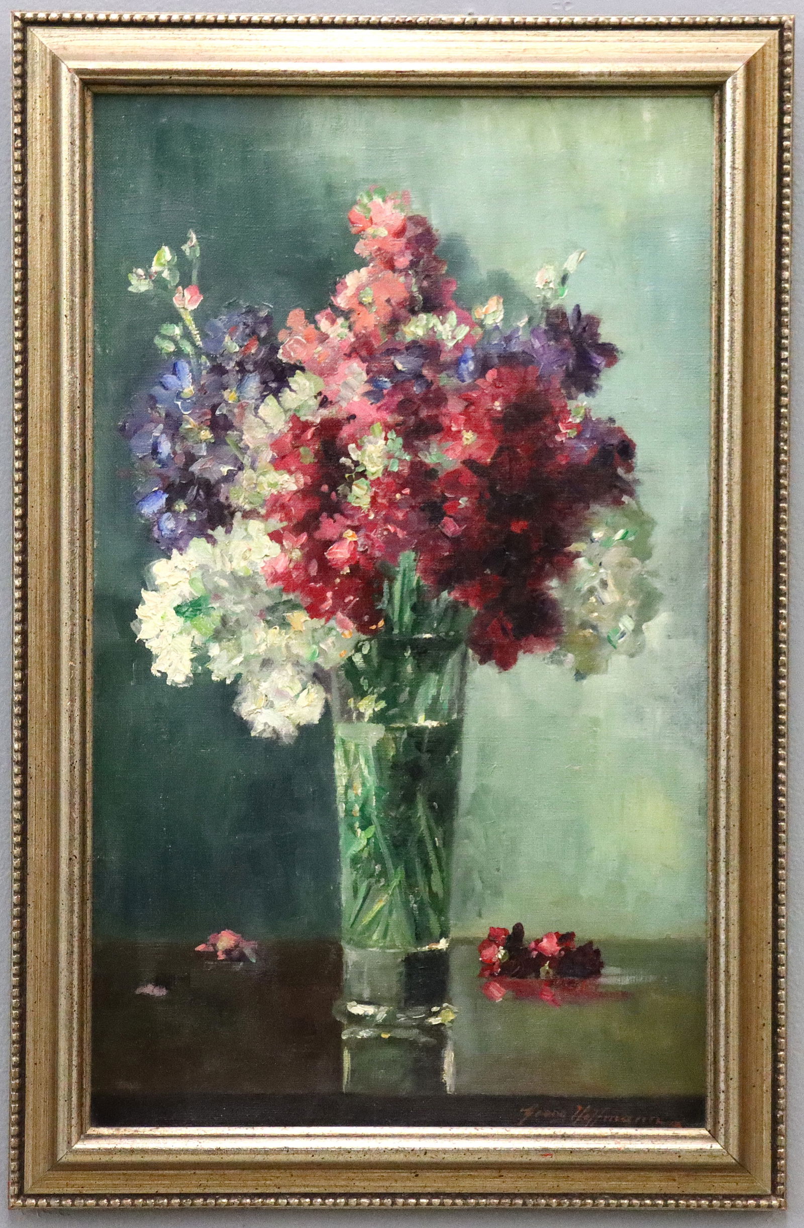 Still Life of Flowers: Georg Hoffmann, German, 19th/20th century. A mid 20th century oil on canvas still life depicting a bouquet of mixed flowers in shades of Pink, White, and Purplish Blue set within a Crystal vase. Signe