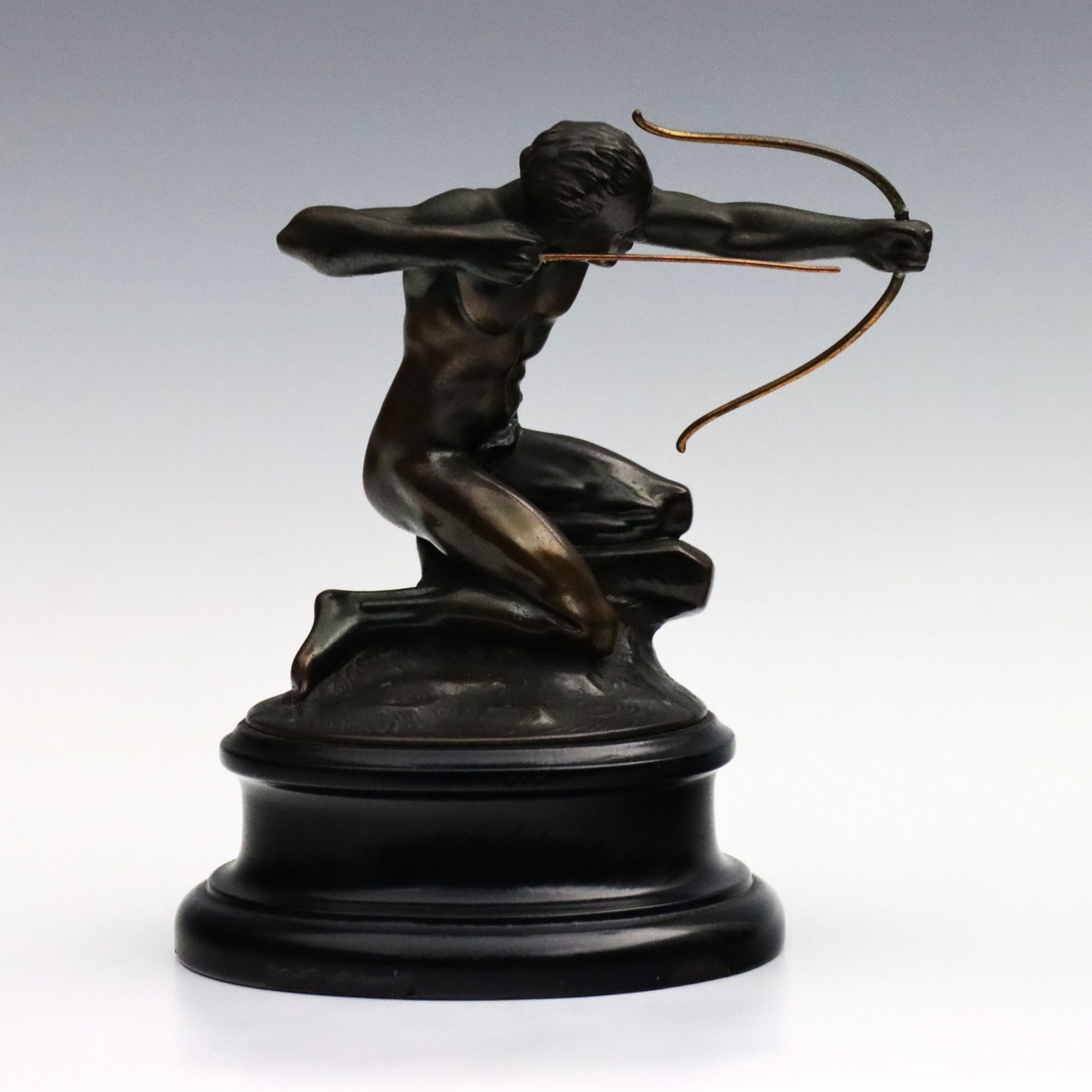 W.N. Schnell Bronze Archer Figure: W.N. Schnell, American, 20th century. An early 20th century Bronze archer figure, entitled "Tireur d'Arc". Designed as a car mascot for Pierce-Arrow motorcar company, presented on an incorporated ebon