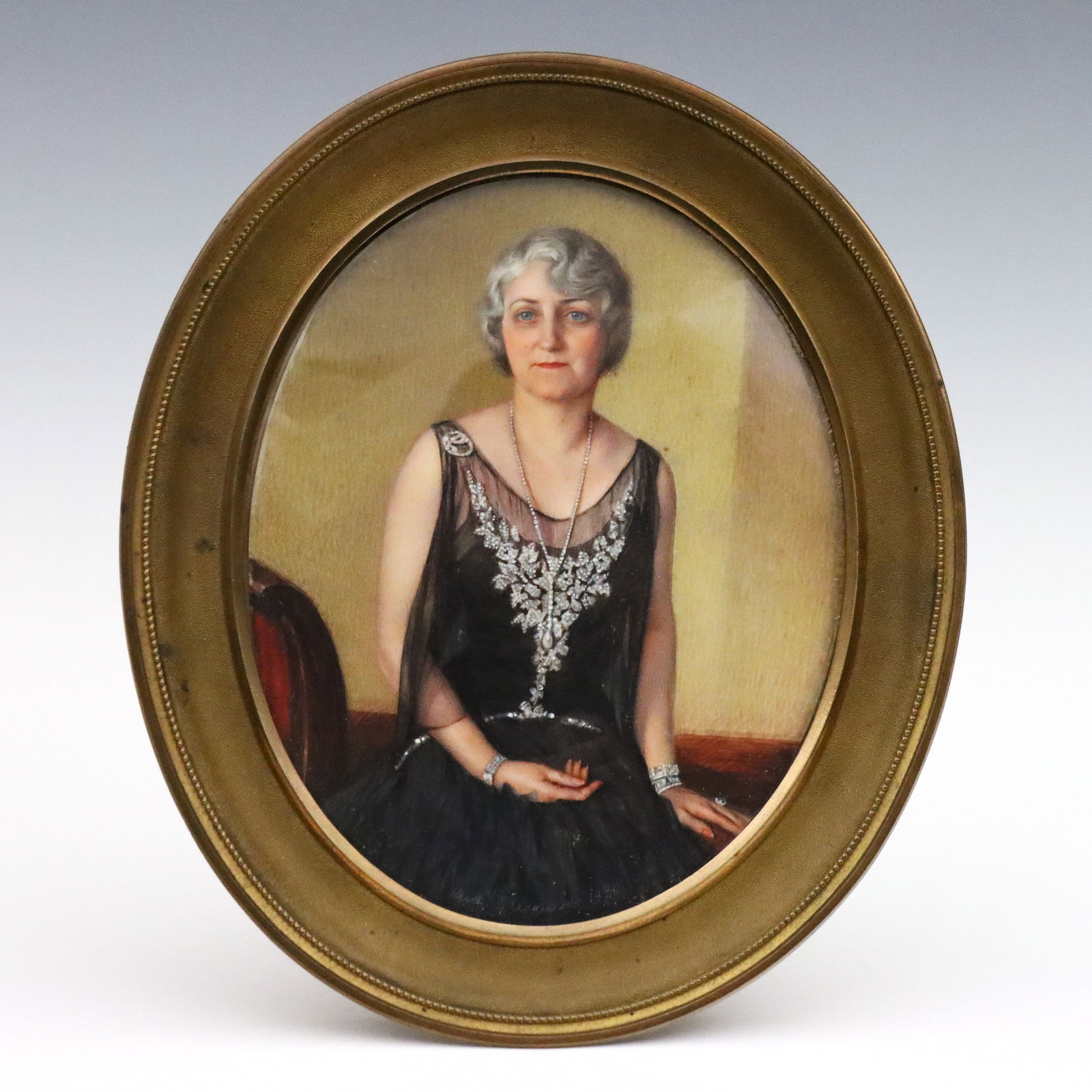 Rudolf Sternad Miniature Portrait of a Woman: Rudolf Sternad, German, 1880-1944. A 1930's miniature painted portrait of a woman. Depicted three-quarter length, seated wearing a Black flapper style dress and diamond jewelry. Signed "Rud.