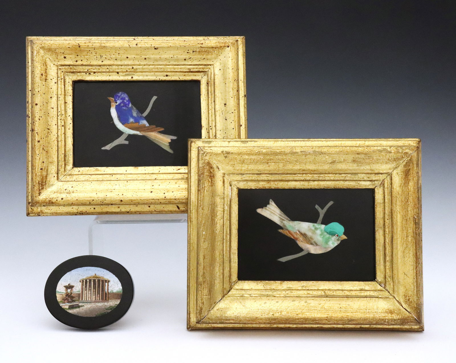 3 Italian Inlaid Stone Plaques: Three turn of the century Italian inlaid stone plaques. Includes a pair Pietra Dura plaques depicting birds and a micro mosaic medallion depicting the Temple of Hercules Victor. Minor surface wear;