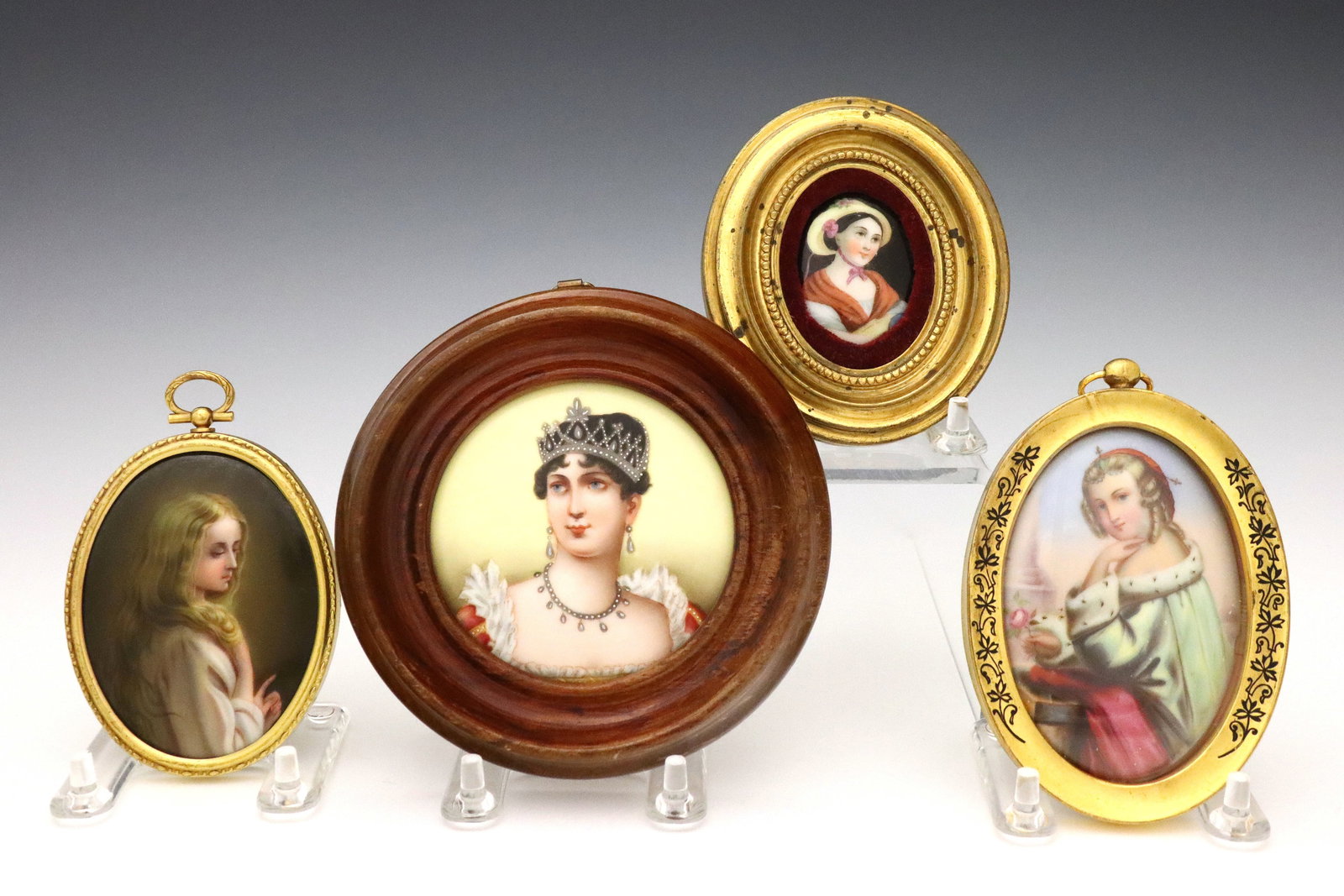 4 Miniature Porcelain Portraits of Women: Four turn of the century Continental miniature porcelain portraits of women. Includes one of Empress Josephine, the first wife of Napoleon, one of a blonde woman wearing an ermine trimmed velvet cape