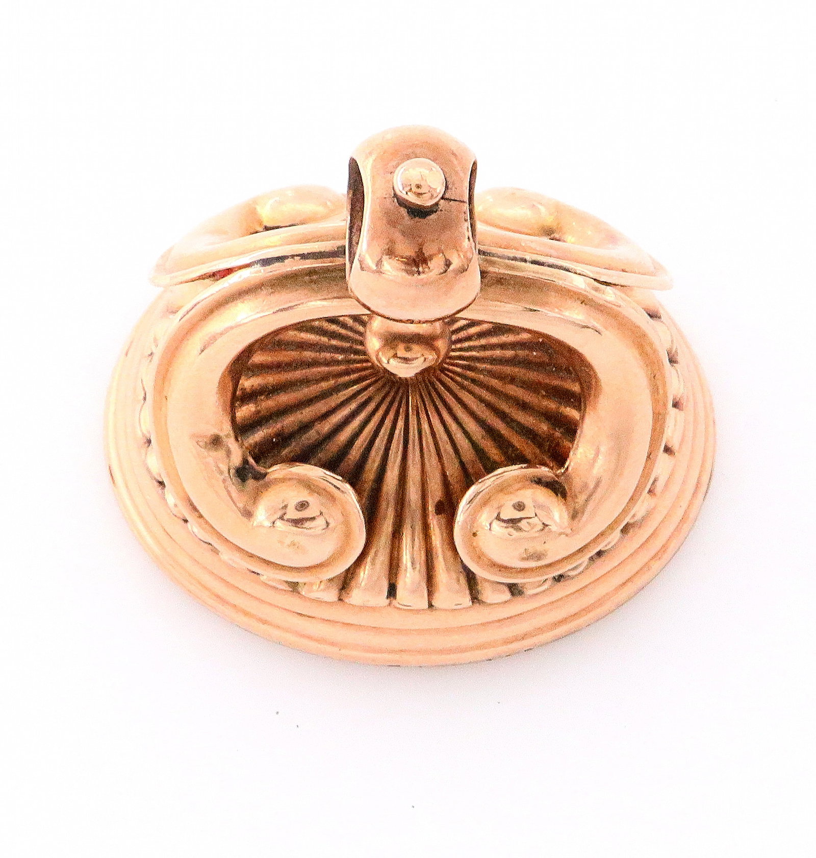 10k Gold Watch Fob: A 10k Gold watch fob with inset Carnelian and carved crest. Double scroll design with fluted body. 18.7 grams total weight. Some wear. ESTIMATE $300-400