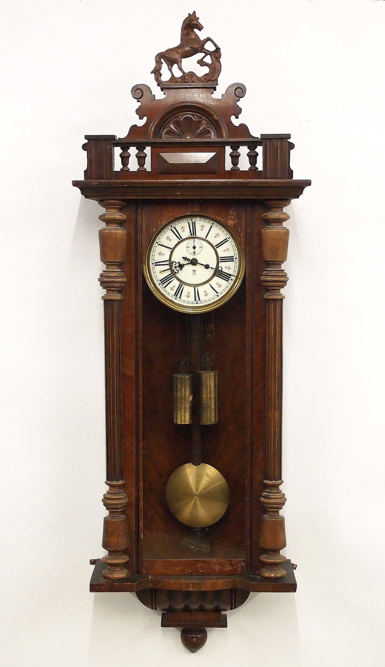 2 Wt Gustav Becker Wall Clock: A 19th century Gustav Becker wall clock. 8-day weight driven time and strike movement with two-part porcelain dial and Arabic numerals with subsidiary seconds, within a molded Brass bezel. Walnut