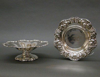 2 Sterling serving bowls: Two Sterling Silver serving bowls. A footed bowl with scalloped edge and a small bowl with Strawberry repousee design. Minor wear, one monogrammed. Up to 8" diameter. 12.70 troy oz. total. ESTIMATE $3