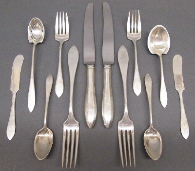 Towle Sterling flatware: A Towle Sterling Silver flatware service in the "Lafayette" pattern, with some pieces by other makers. Five piece settings for eight, plus serving pieces, 43 total pieces. Monogrammed, minor wear. 40.