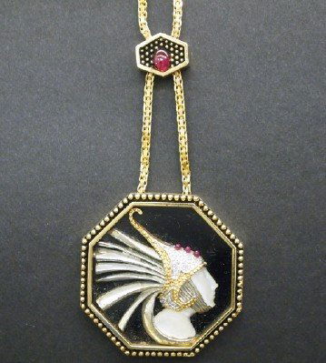 14 k Erte necklace: A 20th century Erte Art Deco "Fireflies" necklace in 14 k Yellow Gold and Sterling Silver with Diamond and Rubies and Mother-of-Pearl carving. On a 19" 14 k Gold chain with jeweled slider. Stamped mar