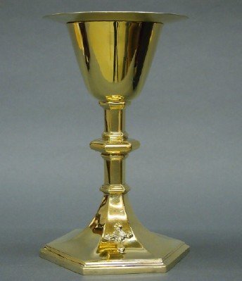 Sterling Communion Chalice: A 20th century Sterling Silver Communion Chalice and Paten. Molded hexagonal base with knopped stem and Gold washed finish with an engraved Gorham Paten. Engraved "..1947... Chicago, Ill.". Includes a
