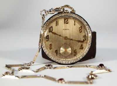 Bulova Platinum pocket watch & chain: An early 20th century Bulova Platinum cased pocket watch with Diamond bezel and matching Platinum chain with inset Rubies. 14 size, 19 jewel, 8 adjustment Swiss "Bulova Phantom, 12p" movement with Sat