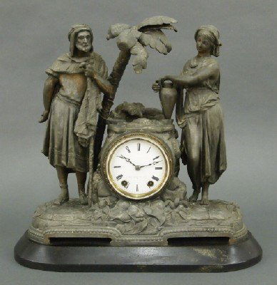 Seth Thomas figural clock: A 19th century Seth Thomas "Rebecca at the Well" figural mantle clock. Spelter figure on a Slate base with an 8-day time & strike movement and porcelain dial marked "Seth Thomas Sons & Co., N.Y." Pati