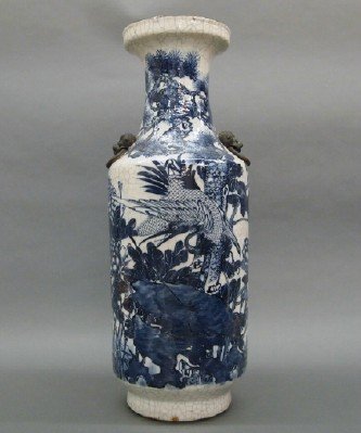 Chinese baluster vase: A 20th century Chinese porcelain baluster vase with Lion's mask ring handles. Blue and White decoration with Cranes in a landscape and crackle glaze. Signed in character on base. Minor wear. 24" high.