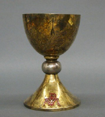 Sterling Communion Chalice: A 20th century Sterling Silver Communion Chalice. Gold wash finish with enameled crest. Slight surface wear. 6 1/2" high. 15.35 troy ozs. ESTIMATE $400-600