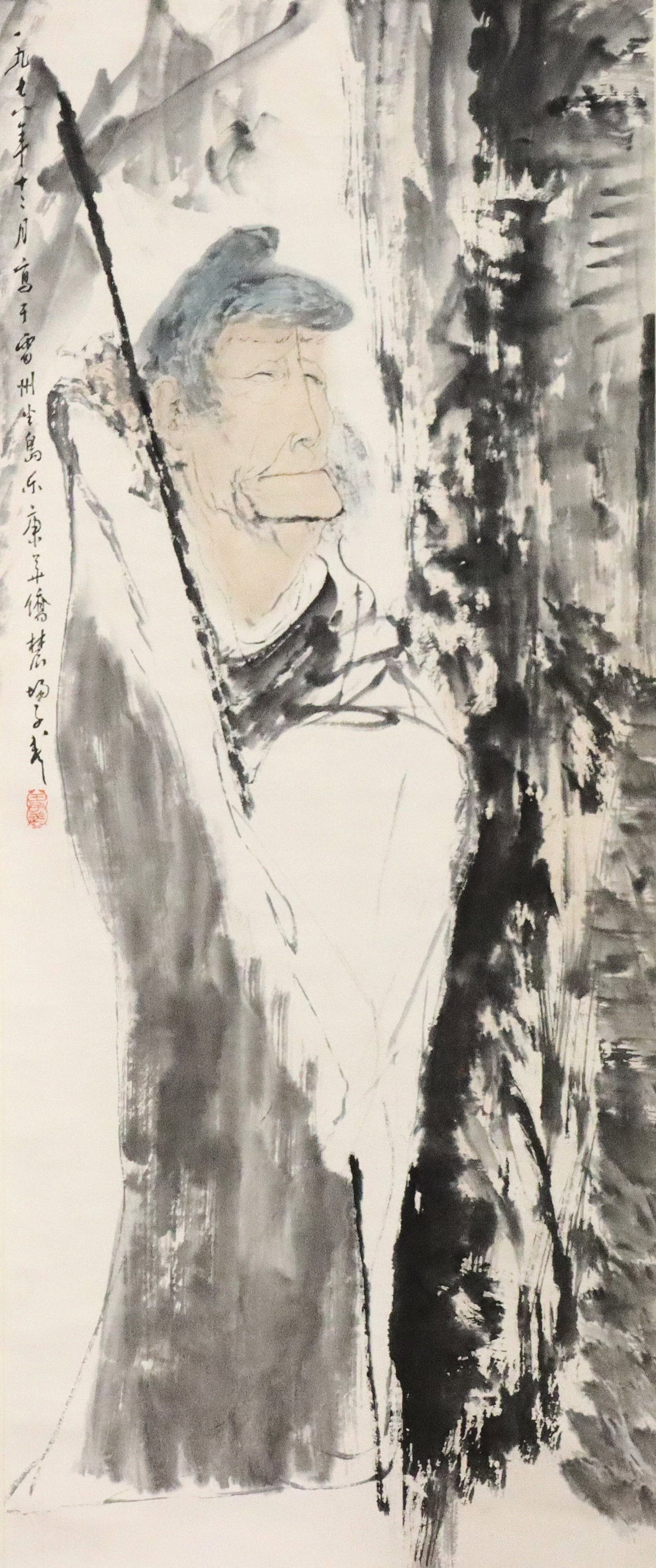 Chinese Hanging Scroll: An ink and color on paper hanging scroll depicting a scholar standing with his staff. Calligraphy with artist seal upper left. Paper with some fading, staining to right side, some creases and wrinkles