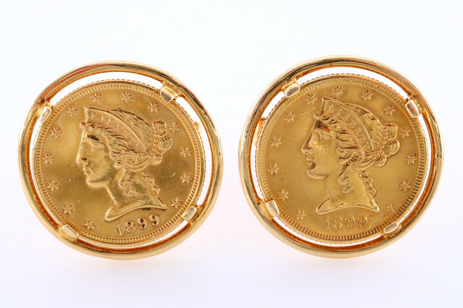 Pr 1899 Liberty Coin 14k Gold Cufflinks: A pair of 1899 $5 Liberty Gold coin and 14k Gold cufflinks. Features 1899 $5 Liberty Head Gold "Half Eagle" coins mounted on 14k Gold cufflinks with swivel backs. Each marked "14k". Slight wear. 28.4 