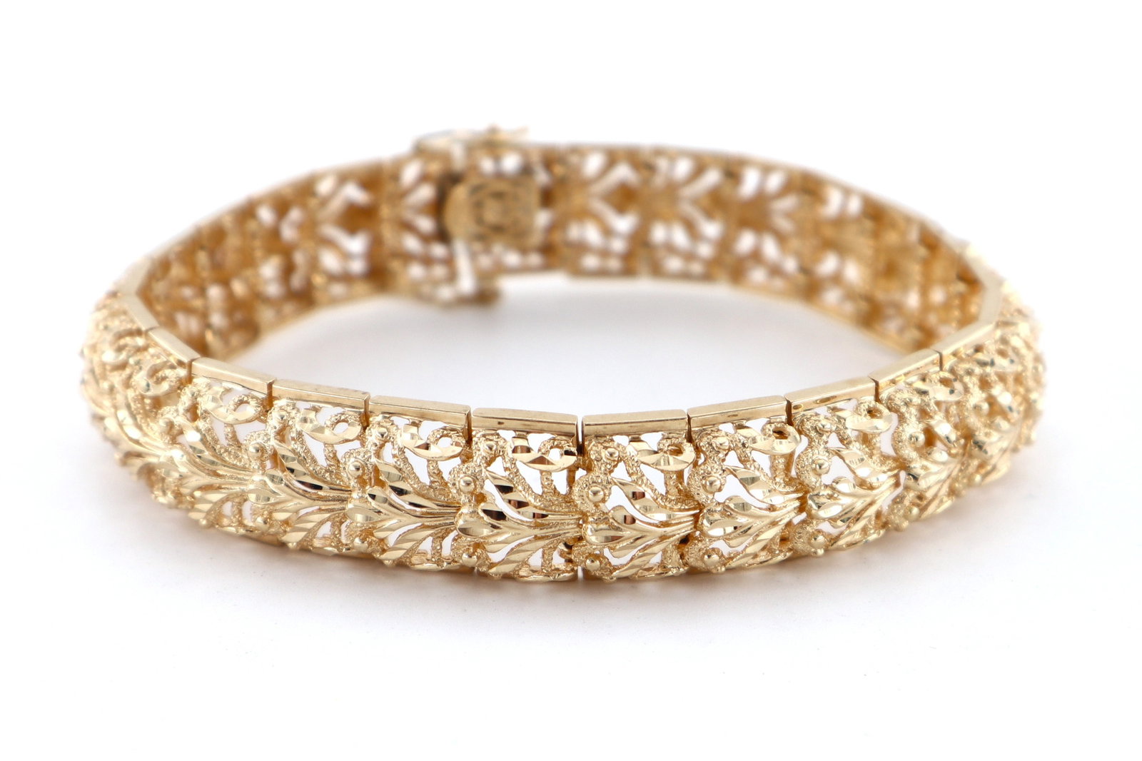 14k Gold Filigree Bracelet: A 14k Gold filigree bracelet. Features rectangular filigree links, 3.75 mm wide. Marked "14k" and "AE" at clasp. 37.6 grams total. Slight wear, safety chain broken. 8 1/2" long open. ESTIMATE $2,000-3