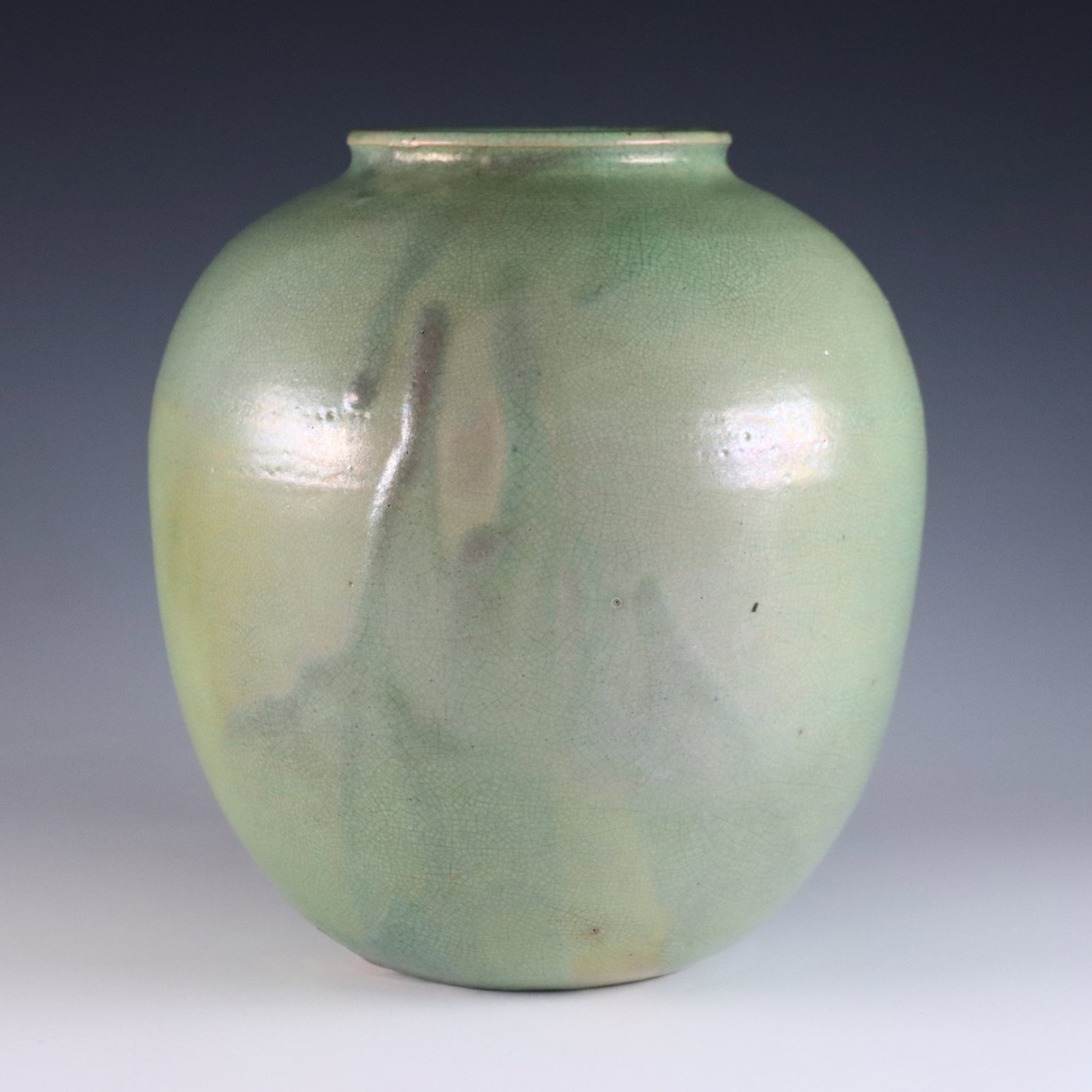 Pewabic Pottery Vase: An early 20th century Pewabic Pottery vase. Ovoid form with iridescent glaze in shades of Green and Gold. Impressed circular "Pewabic Detroit" mark. Crazing, minor surface wear. 6 1/2" high. ESTIMATE 