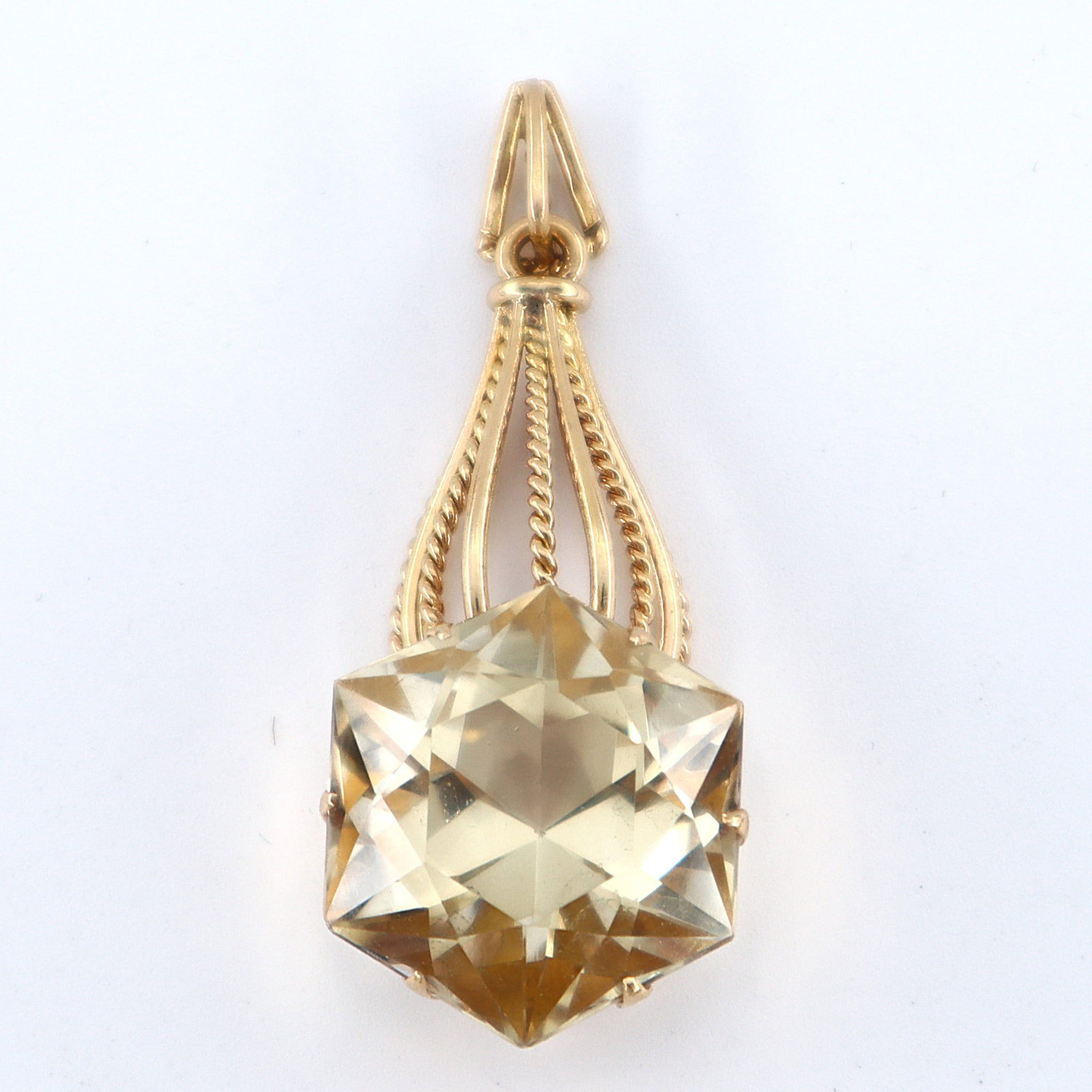 14k Gold & Citrine Pendant: A 14k Gold and Citrine necklace pendant. Features a hexagonal cut prong set pale Yellow Citrine, approx. 19.5 x 22.3 mm, on an openwork pendant with roped design. Unmarked, tested 14k. 14.0 grams tota