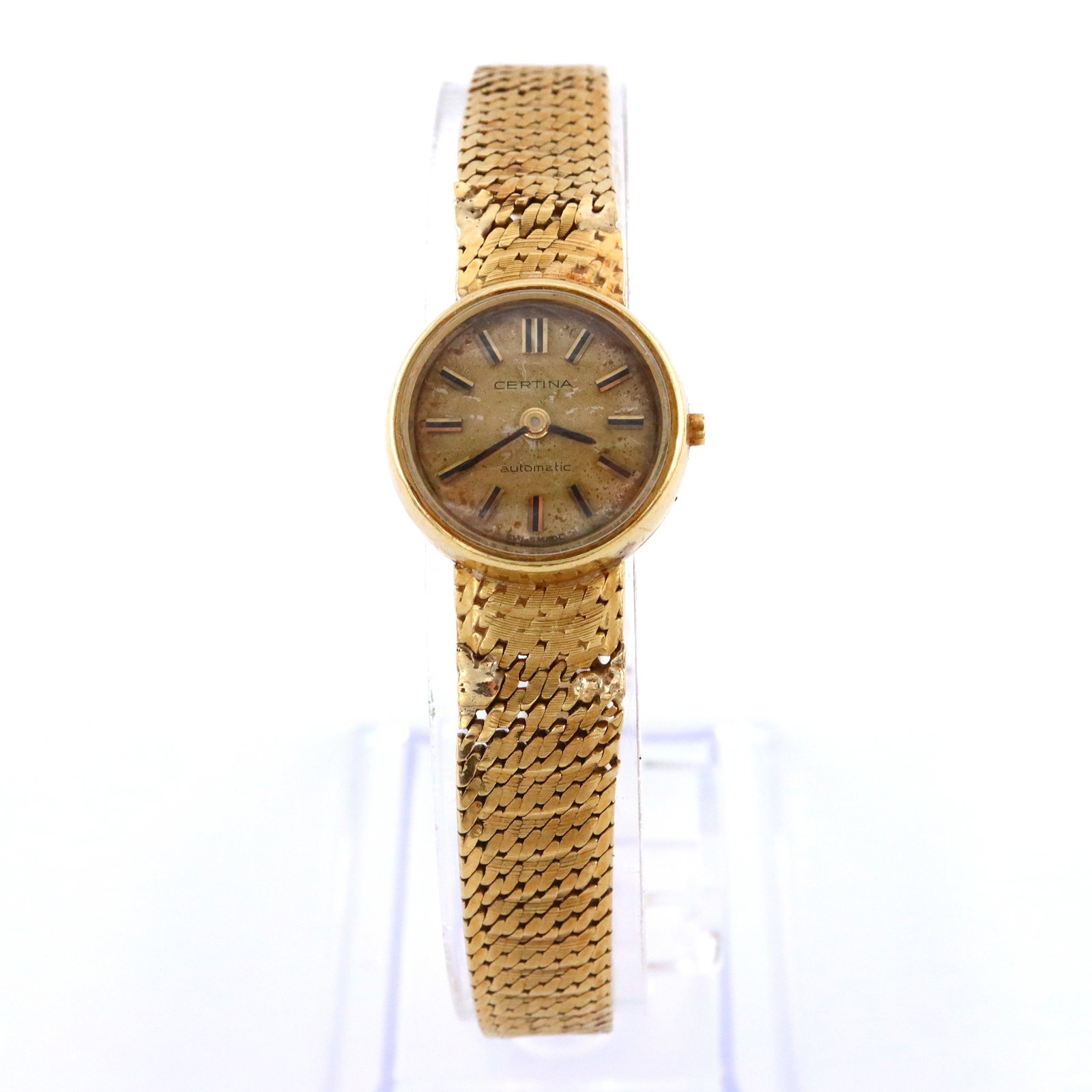 Ladies 18k Gold Wristwatch: A vintage ladies Certina 18k Gold wristwatch. 32j, manual wind with a gold painted metal dial and baton markers. 18k Gold case with a mesh band. Marked "18k / 750" at case interior and "750" at clasp.
