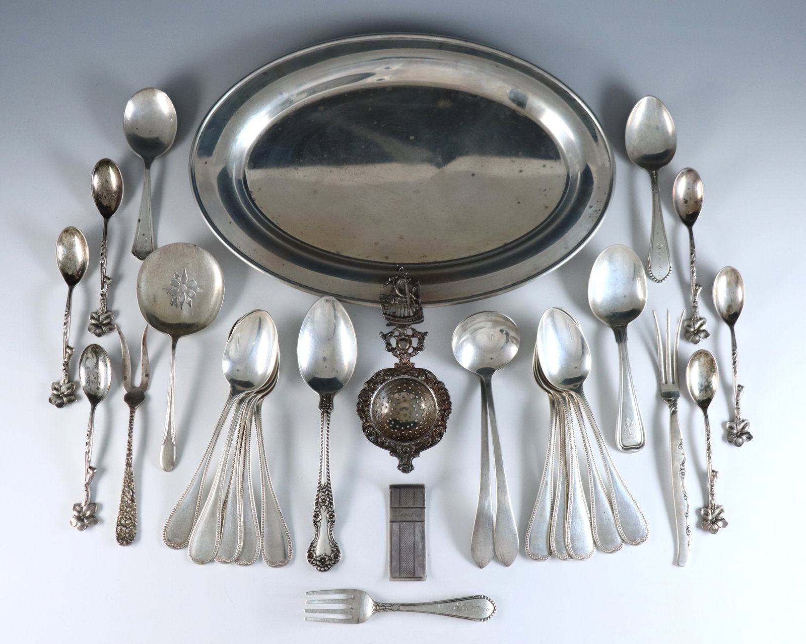 29 pc Sterling & .800 Silver Tableware: Twenty-nine pieces of Sterling and .800 Silver tableware. Eighteen Sterling items including spoons, forks and a tray (13.72 ozt), with eleven .800 Silver items including a set of teaspoons and a tea s