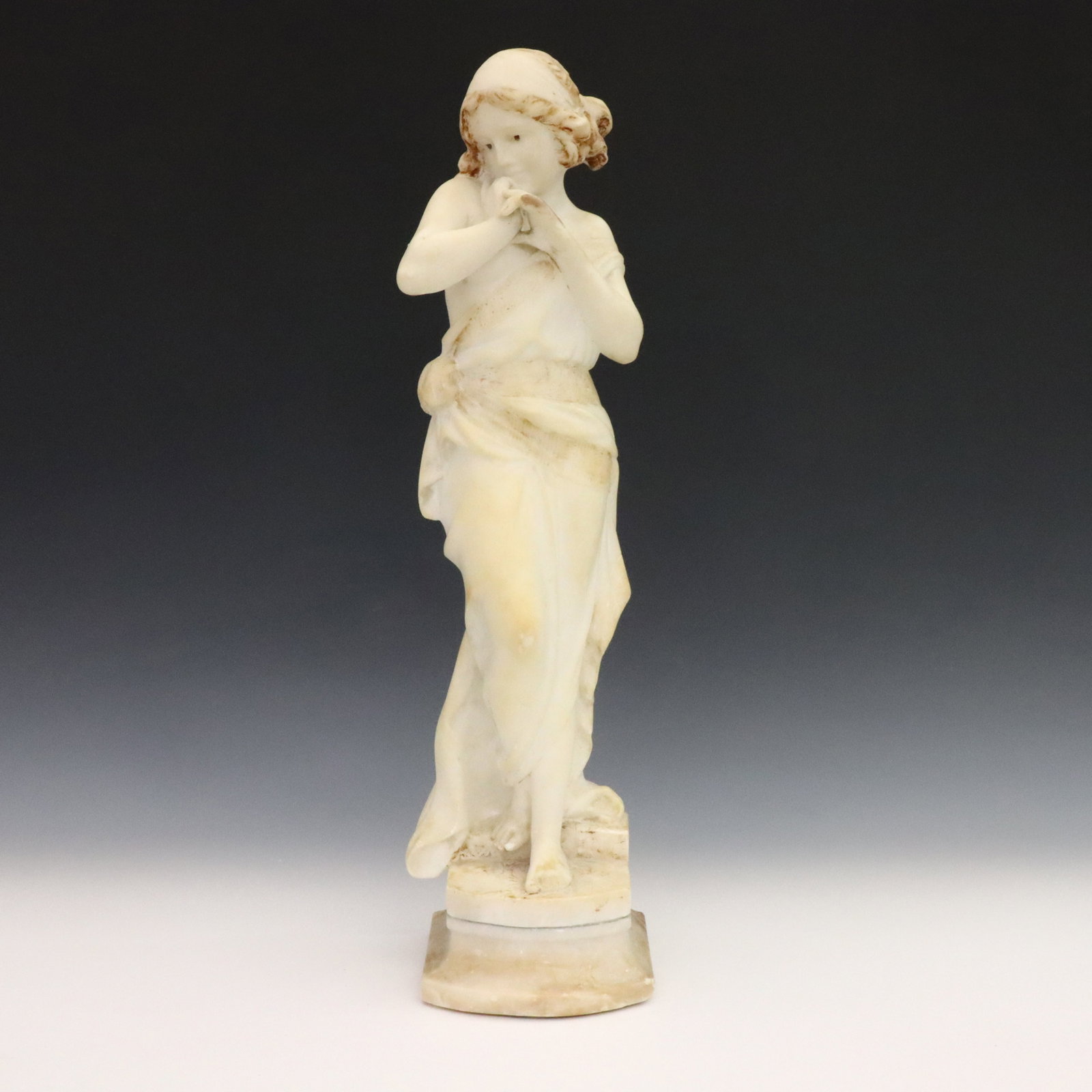 Antonio Frilli Alabaster Figure: Antonio Frilli, Italian, 1860-1892. A late 19th century Alabaster figure of Neoclassical young woman on an incorporated plinth. Signed "A. Frilli", incised "Florence" and "Made in Italy" on the revers
