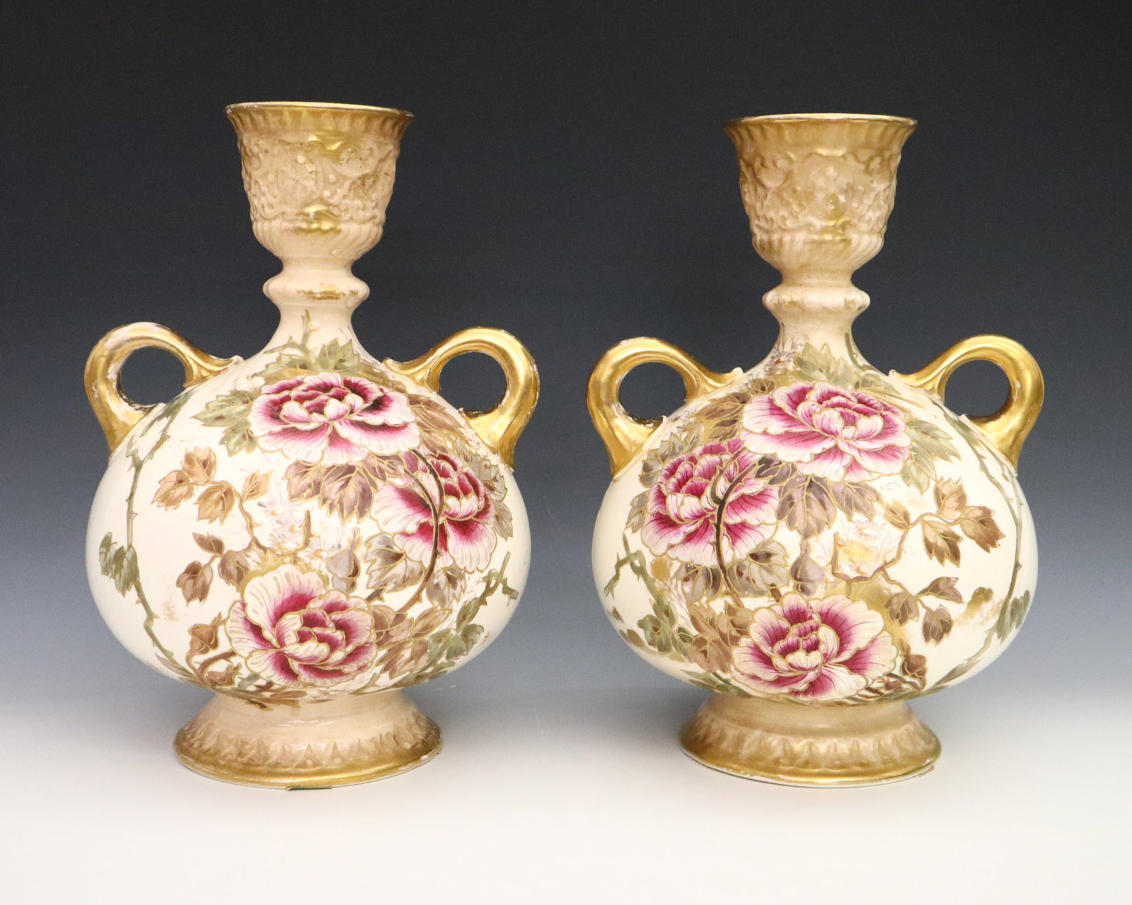 Pr Royal Bonn Porcelain Vases: A pair of late 19th century Royal Bonn porcelain vases. Bulbous form with two handles and multi-color floral decoration with Gilded detail. Printed "Bonn" and Crown, with painted and impressed marks. 