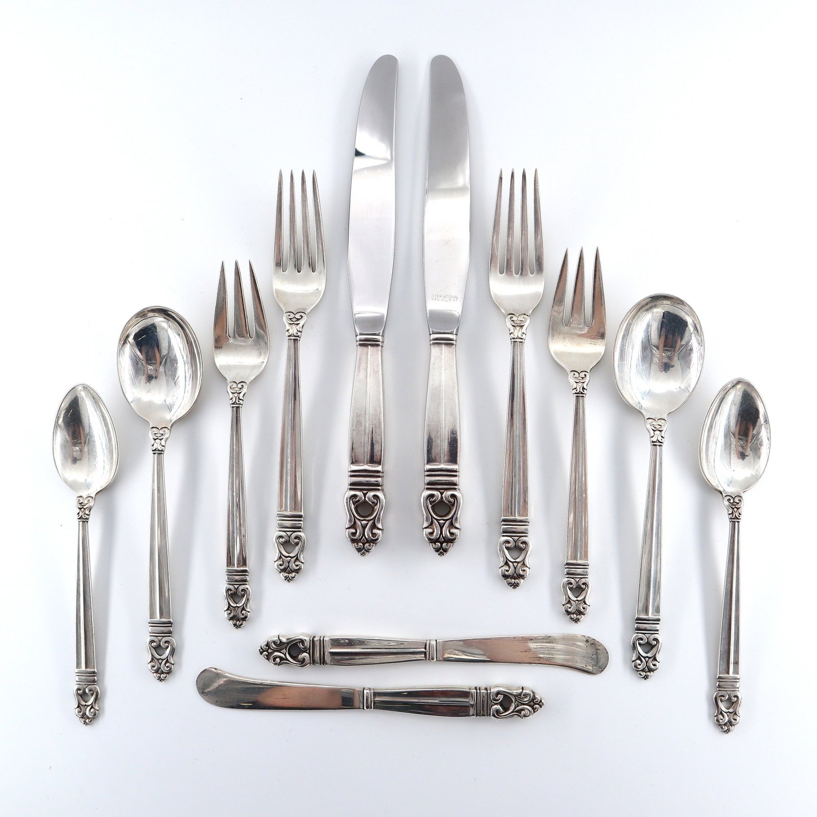 64 pc International Royal Danish Sterling Flatware: Sixty-four pieces of International "Royal Danish" pattern Sterling Silver flatware. Features 8 six-piece place settings plus additional flatware and serving utensils. Includes 8 x 8 7/8" hollow handle