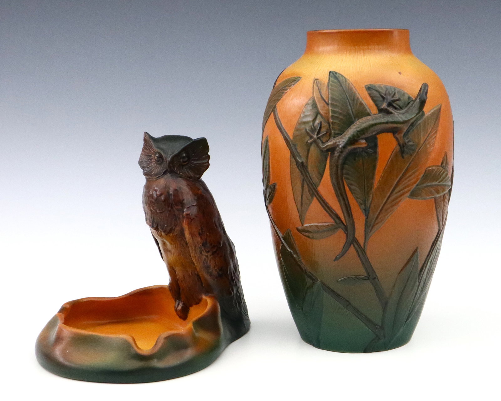 2 pc P. Ipsens Enke Art Pottery: Two pieces of early 20th century P. Ipsens Enke Art Pottery. Molded bodies with multi-color decoration, includes a vase with Lizard and foliate design, and ashtray with Owl design. Impressed "PIE" wit