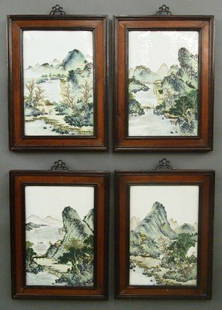 4 Chinese Porcelain plaques: A set of four Chinese Porcelain plaques with molded hardwood frames. Hand painted landscapes in the Famille Verte palette. Minor frame wear, no damage. Each 14 1/4 x 19 1/4" overall. ESTIMATE $10,000-